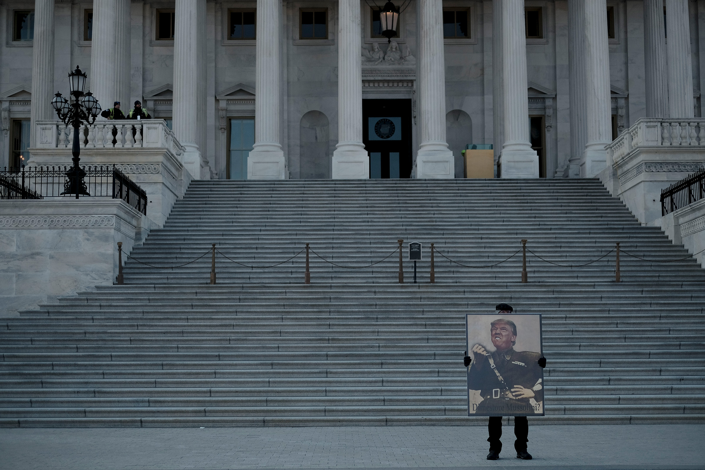 A protestor demonstrates against President Donald Trump in front of the Capitol during the senate impeachment trial in Washington, D.C., on Jan. 29, 2020. (Gabriella Demczuk for TIME)