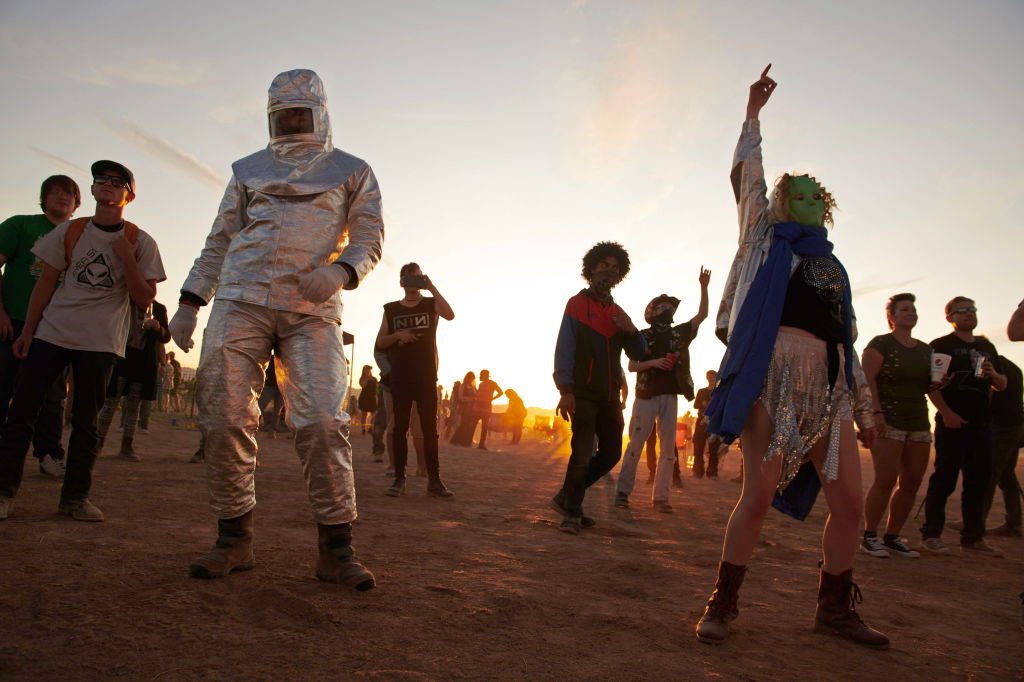 Attendees dance to music during Alienstock festival on the "Extraterrestrial Highway in Rachel, Nevada on September. 20, 2019. (Bridget Bennett—AFP/Getty Images)