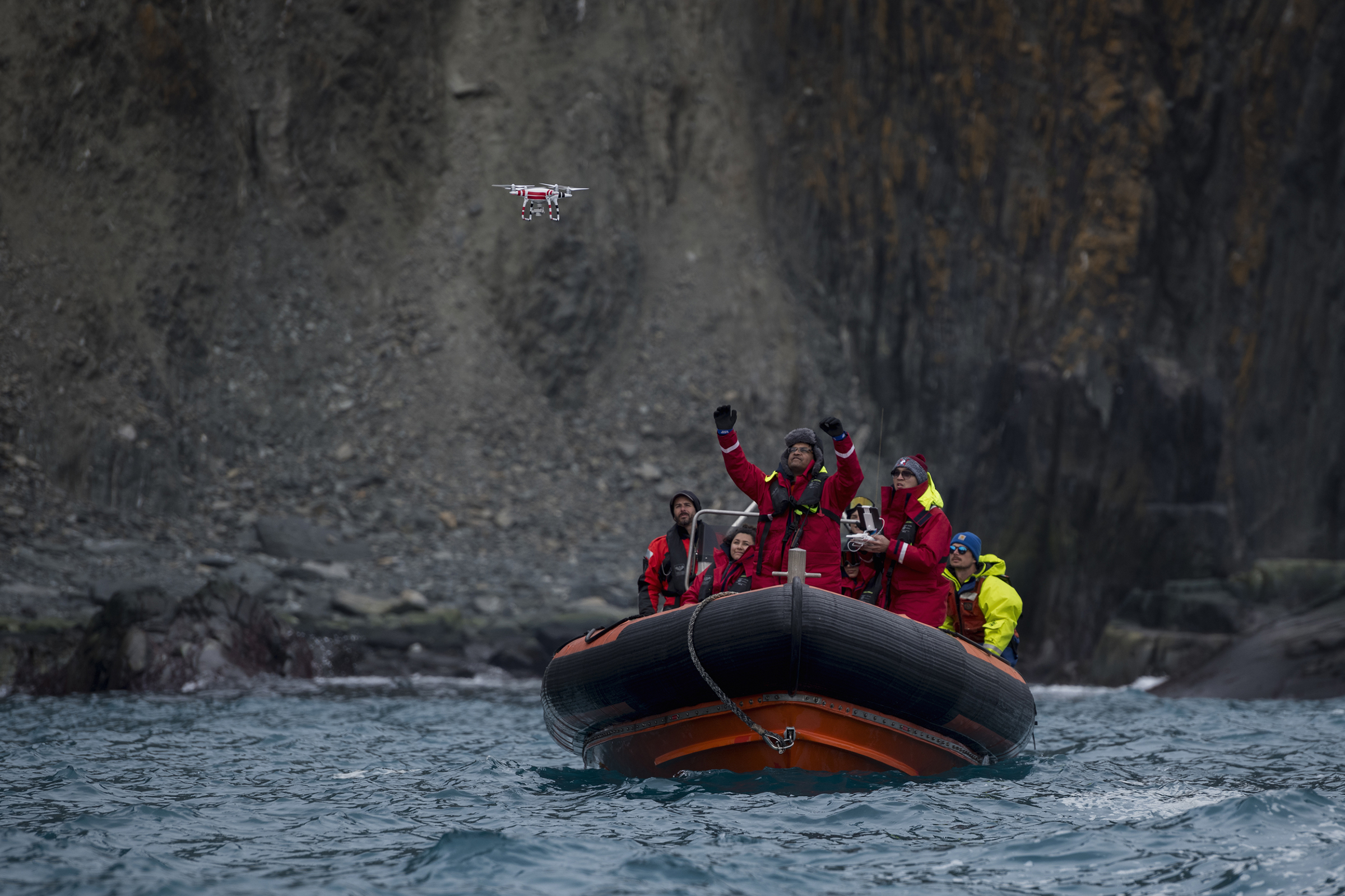 Yang Liu and Vikrant Shah, from North Eastern University, launch a drone from a Greenpeace inflatable. They will later use machine learning to do an automated count of penguin colonies on Elephant Island. The drone counts are later compared to the manual counts done by another team of scientists. (Christian Åslund —Greenpeace and TIME)