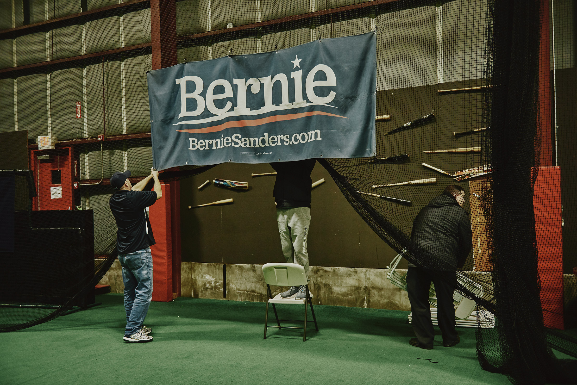 Workers clean up after the Bernie Sanders 2020 Debate Watch Party at the Ultimate Sports Academy in Manchester, N.H. on Feb. 7, 2020. (Tony Luong for TIME)