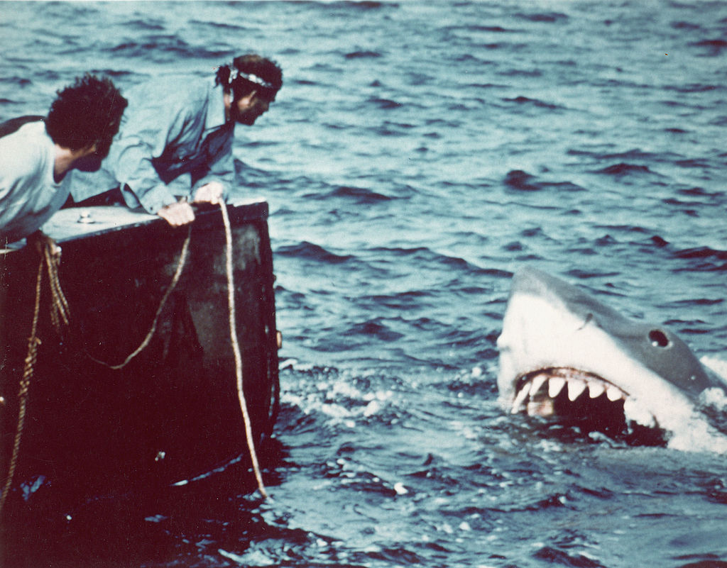 Actor Richard Dreyfuss (left) (as marine biologist Hooper) and British author and actor Robert Shaw (as shark fisherman Quint) look off the stern of Quint's fishing boat the 'Orca' at the terrifying approach of the mechanical giant shark dubbed 'Bruce' in a scene from the film <i>Jaws</i>. (Universal Pictures—Getty Images)
