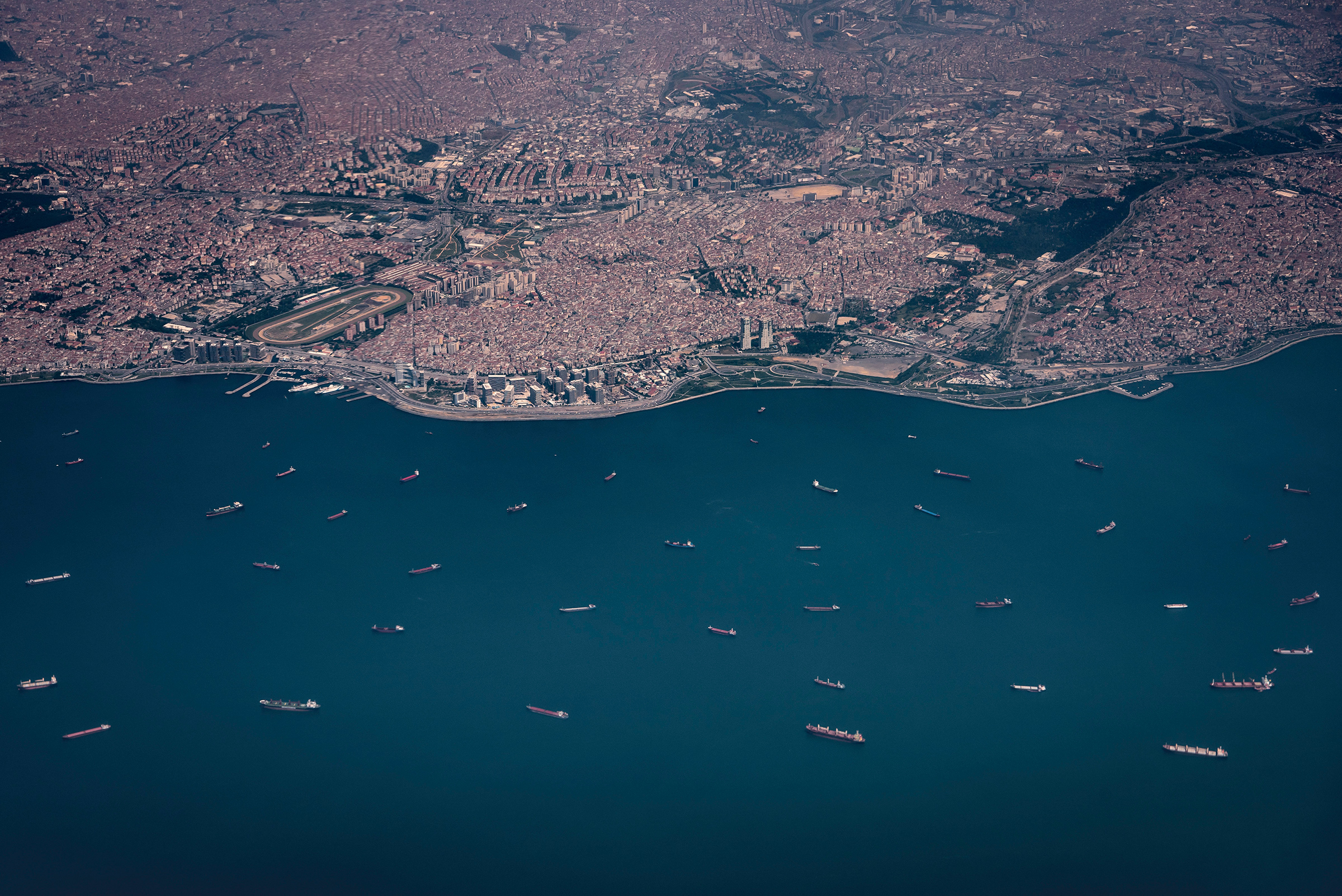 Cargo ships wait for their turn to enter the Bosporus Strait outside Istanbul in June 2018. (Sergey Ponomarev—The New York Times/Redux)