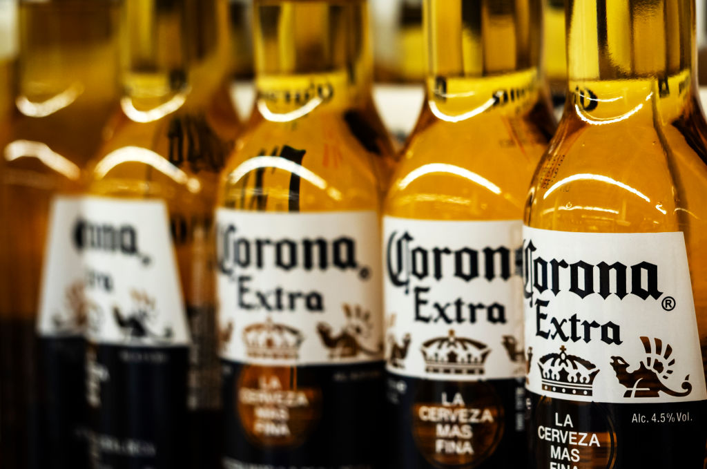 Detail of lined up Corona beer bottles seen on the store shelf. Corona extra Lager Beer is the flagship product of the Mexican company Grupo Modelo. (Igor Golovniov—SOPA Images/LightRocket/Getty Images)