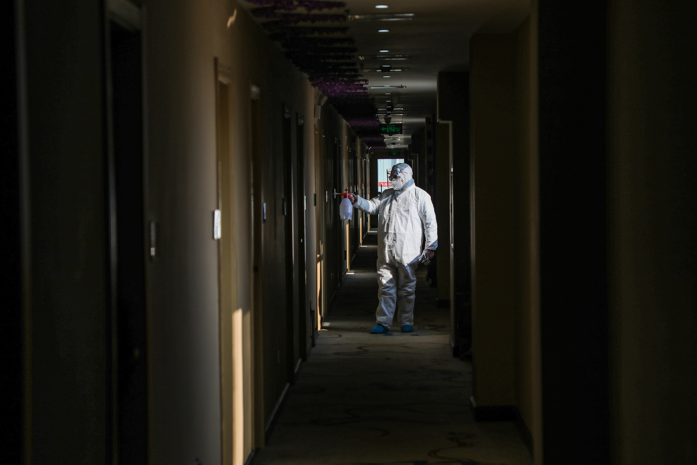 A medical worker disinfects a hotel converted into a quarantine zone in Wuhan, on Feb. 3 (AFP/GETTY IMAGES)