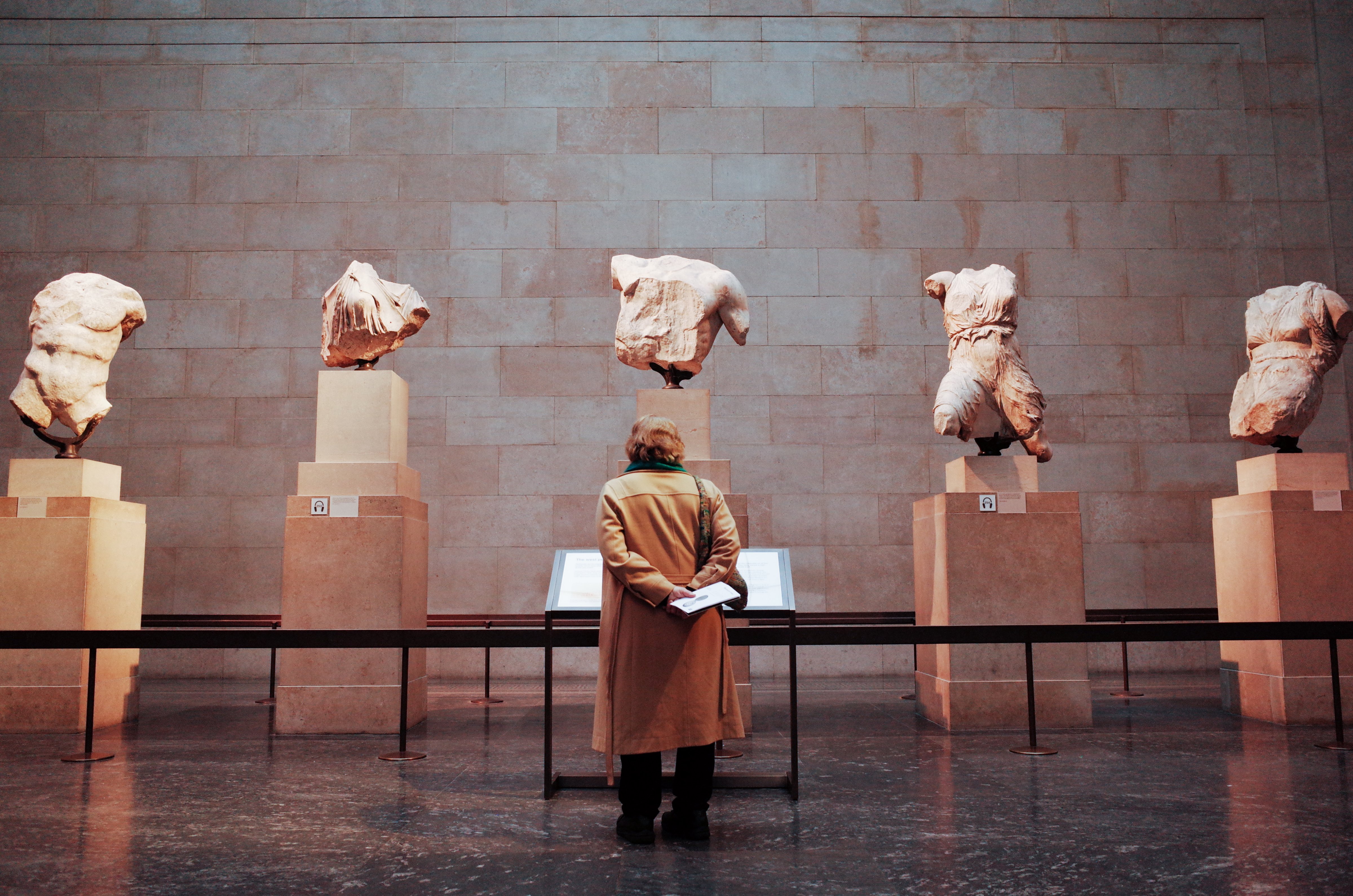 A woman looks at a section of the Parthenon Sculptures exhibit in the British Museum in London, England, on February 13, 2020. (David Cliff—NurPhoto/Getty Images)