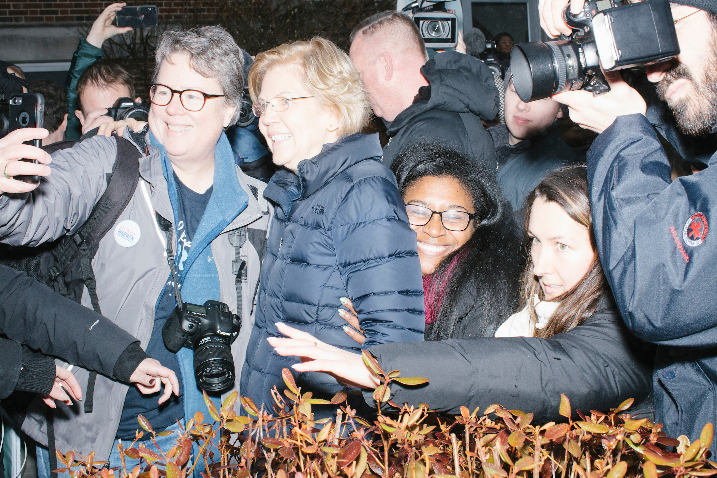 Media surrounds Democratic presidential candidate Sen. Elizabeth Warren as she greets supporters outside a polling place at Webster Elementary School in Manchester, N.H., on Feb. 11, 2020. (M. Scott Brauer for TIME)