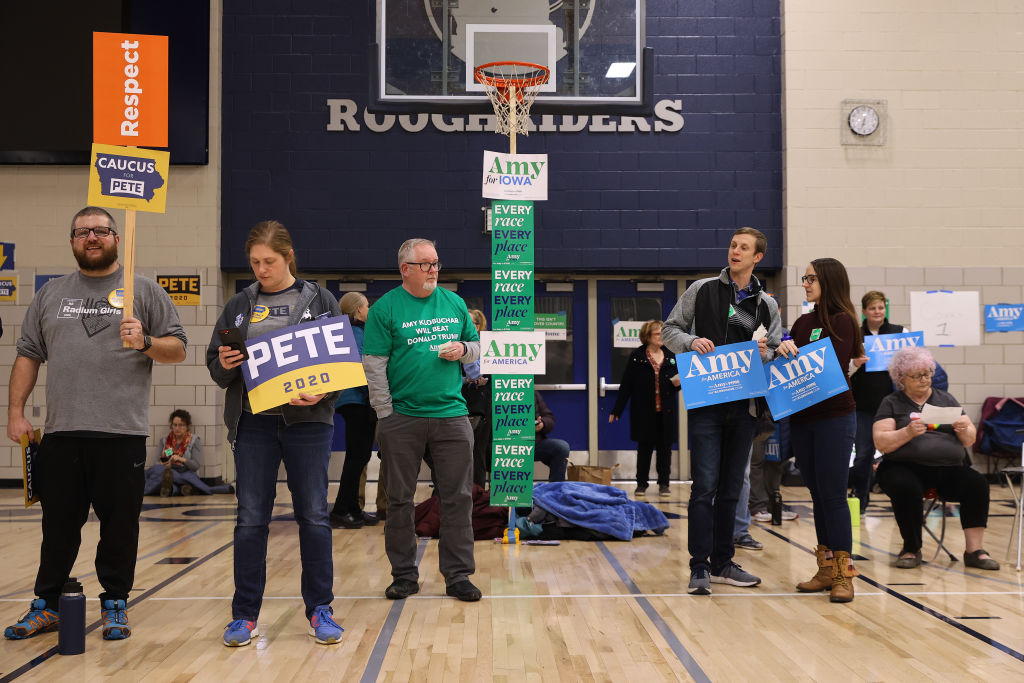 Supporters of Democratic presidential candidates former South Bend, Indiana Mayor Pete Buttigieg and Sen. Amy Klobuchar prepare to caucus for them in the gymnasium at Roosevelt High School in Des Moines, IA on Feb. 3, 2020. (Chip Somodevilla—Getty Images)