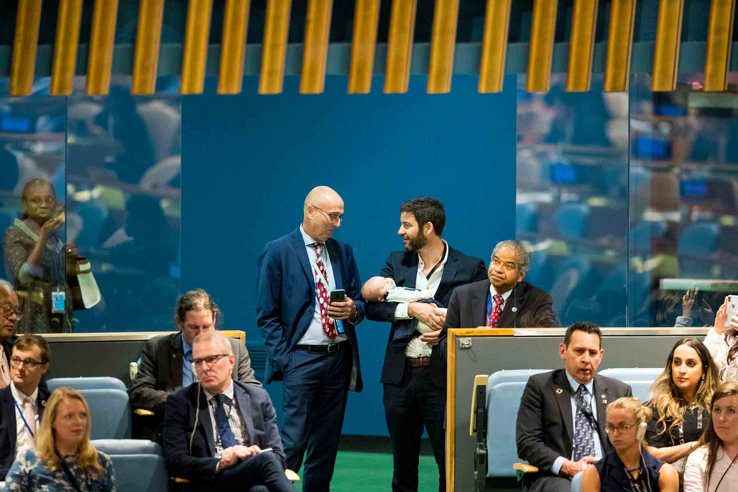 Ardern’s partner Clarke Gayford holds their daughter Neve as her mother addresses the U.N. in September 2018