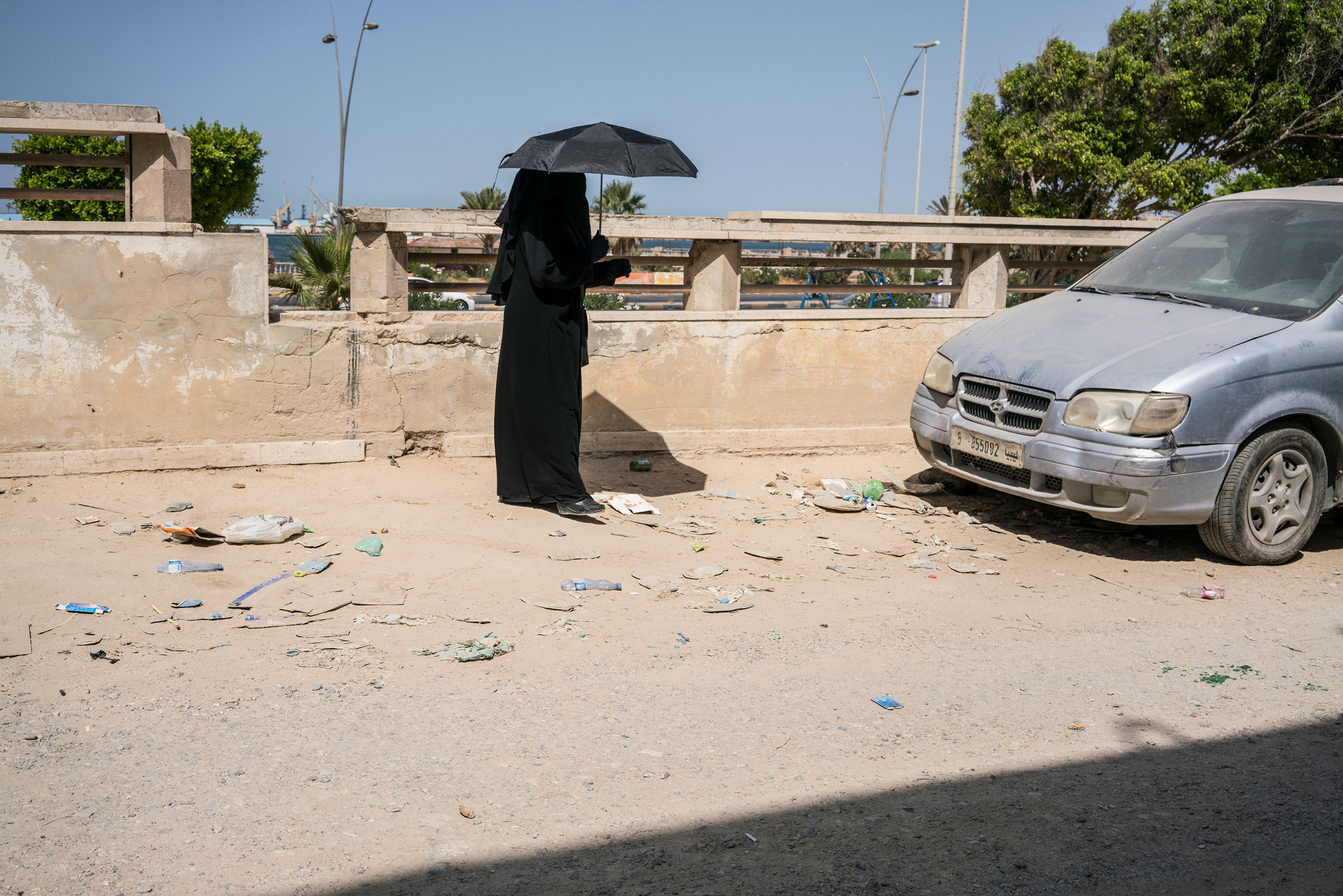 A woman on a road near the old city in Tripoli on July 5, 2019. (Emanuele Satolli)