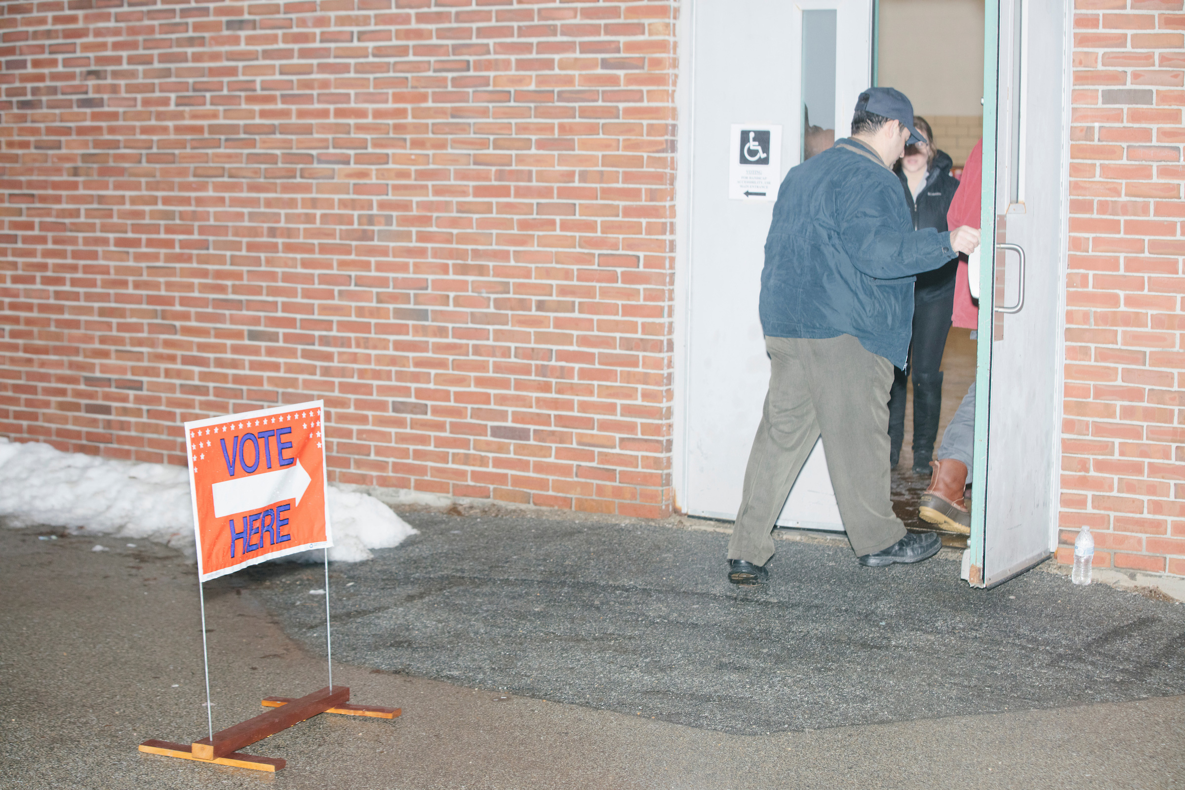 People arrive to vote in the New Hampshire Presidential Primary at Fair Grounds Junior High School in Nashua, N.H., on Feb. 11, 2020. (M. Scott Brauer for TIME)