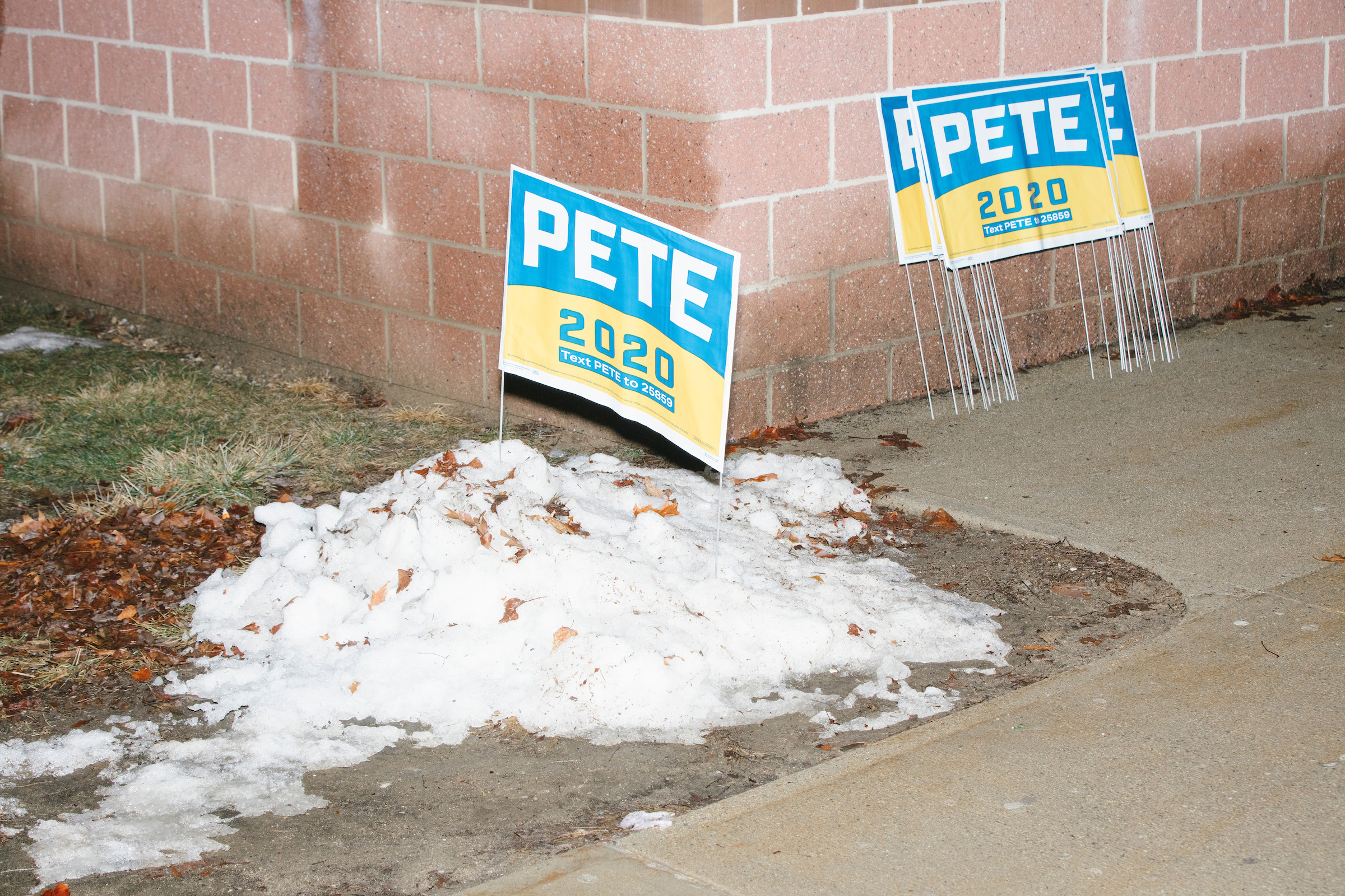 Campaign signs for Democratic presidential candidate and former South Bend, Ind., mayor Pete Buttigieg stand outside Exeter High School before a campaign rally in Exeter, N.H., on Feb. 10, 2020. (M. Scott Brauer for TIME)
