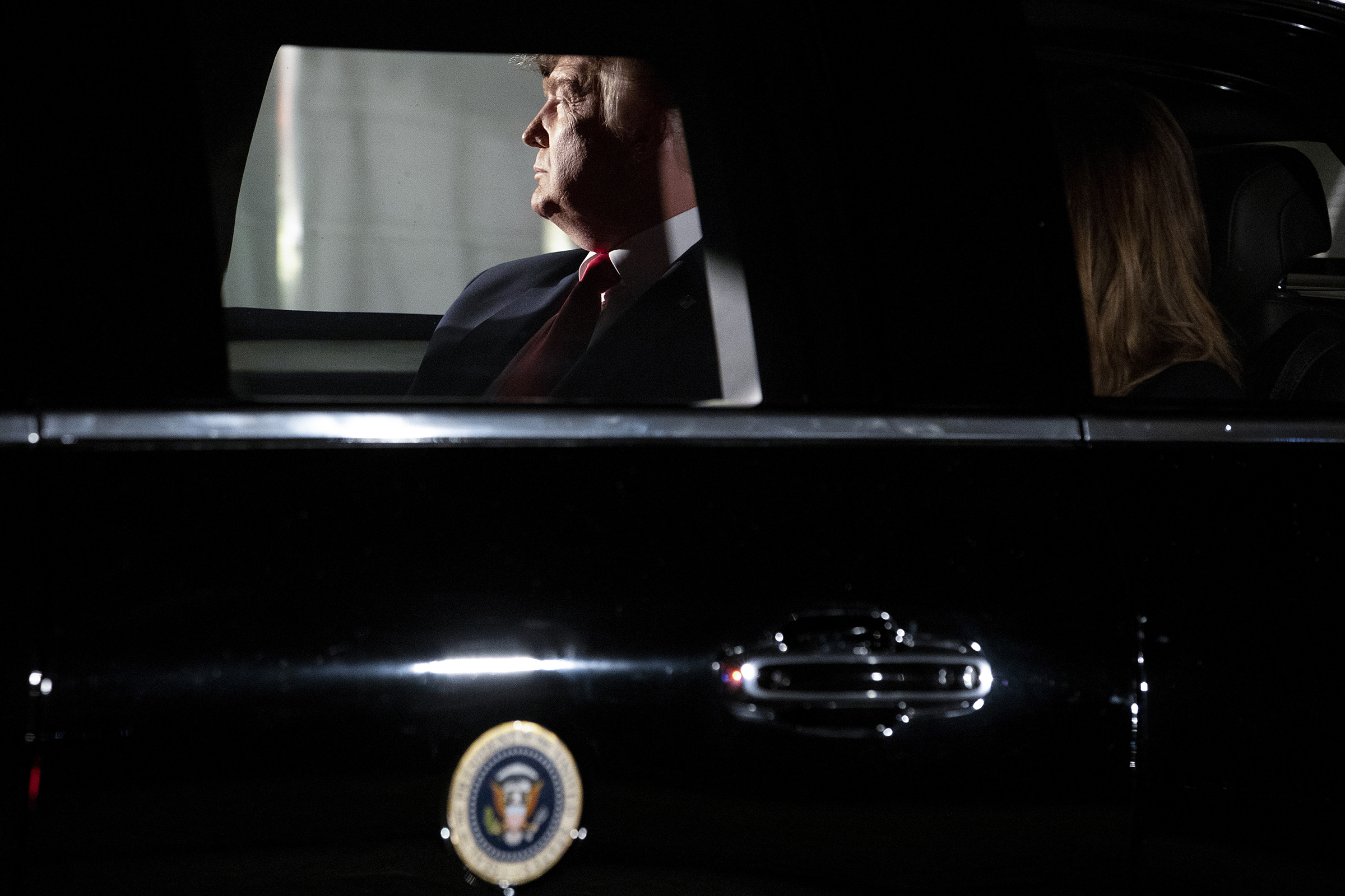 President Donald Trump sits in the presidential motorcade