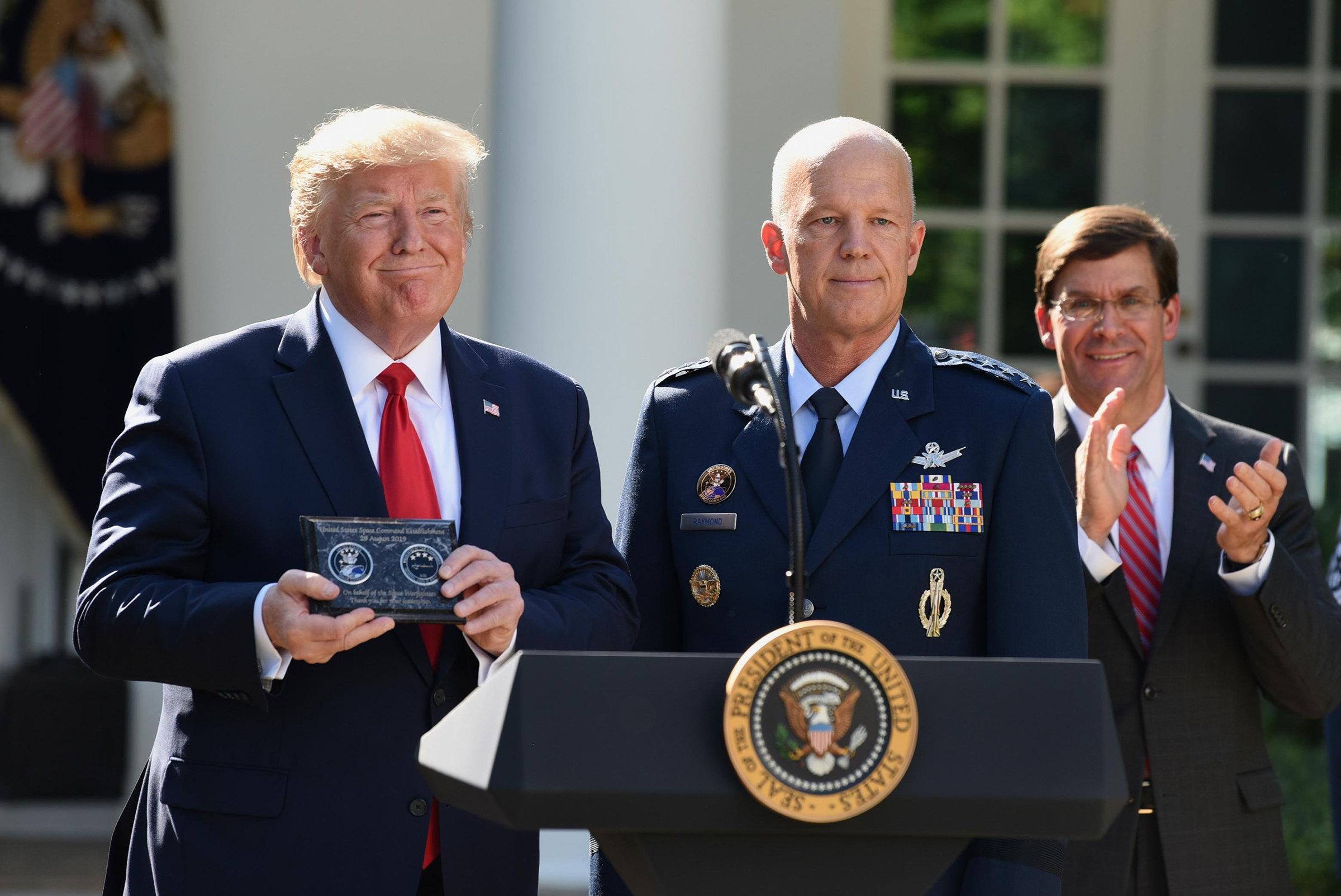 President Donald Trump and General John "Jay" Raymond attend a ceremony marking the establishment the U.S. Space Command at the White House on Aug. 29, 2019. (Chen Mengtong—China News Service/VCG via Getty Images)