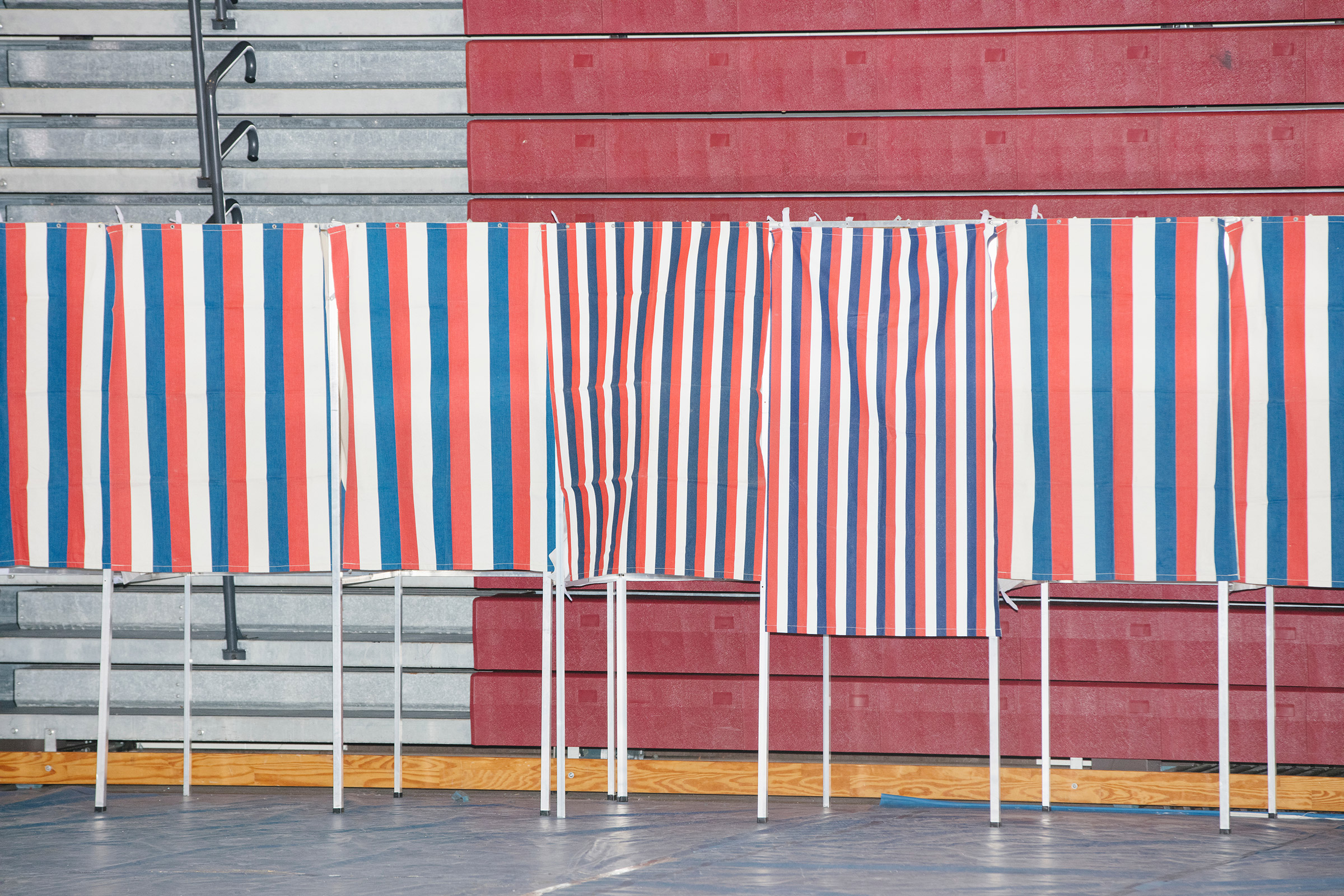 Voting booths stand empty during the New Hampshire Presidential Primary at Bedford High School in Bedford, N.H., on Feb. 11, 2020. (M. Scott Brauer for TIME)