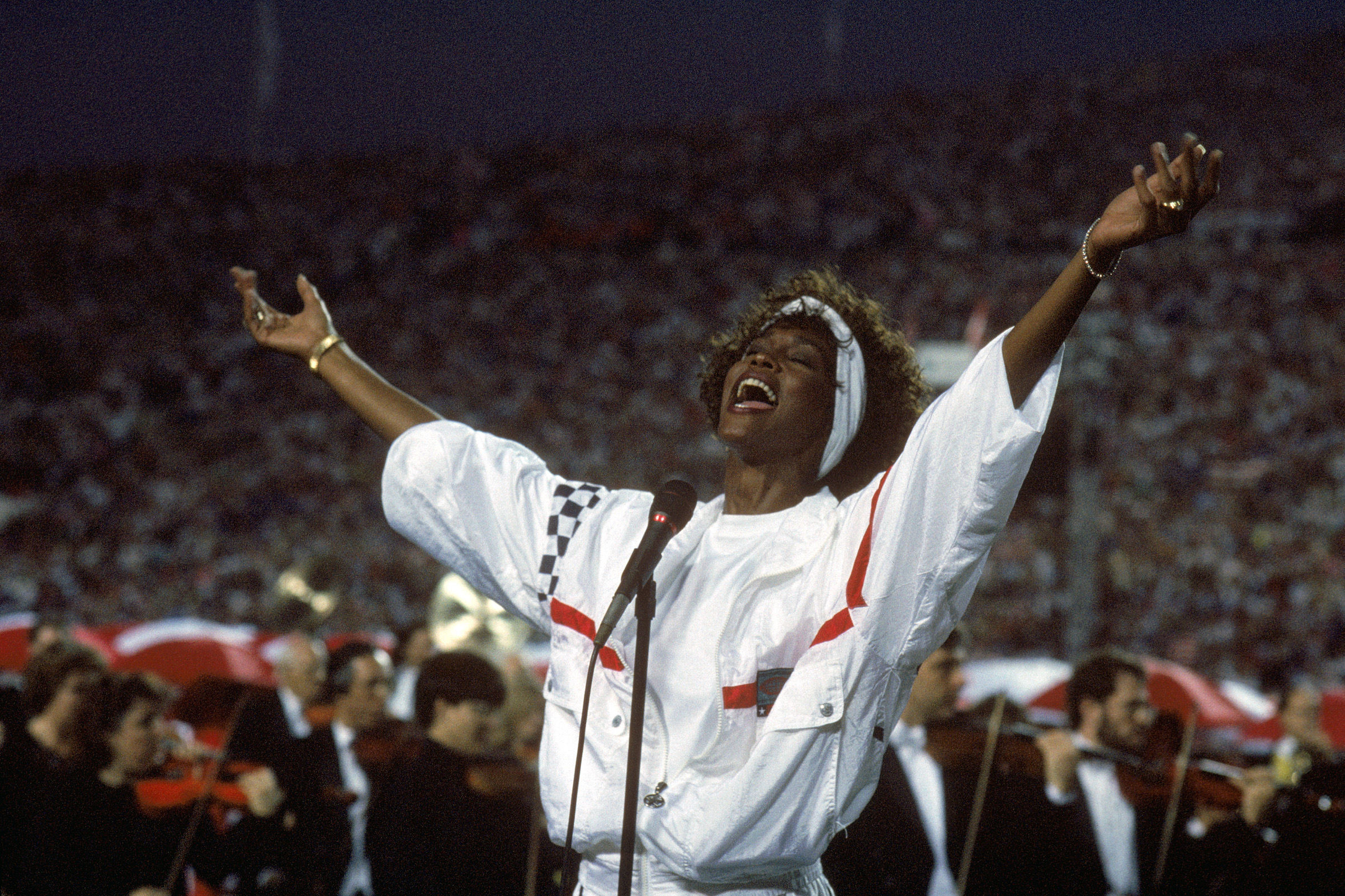 Whitney Houston sings the National Anthem before a game with the New York Giants taking on the Buffalo Bills prior to Super Bowl XXV at Tampa Stadium on Jan. 27, 1991 in Tampa, Fla. (Getty Images)
