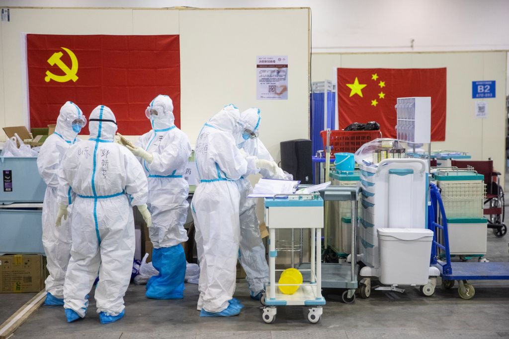 This photo taken on Feb. 17, 2020 shows medical staff members working at an exhibition centre converted into a hospital in Wuhan in China's central Hubei province. (STR/AFP/Getty Images)