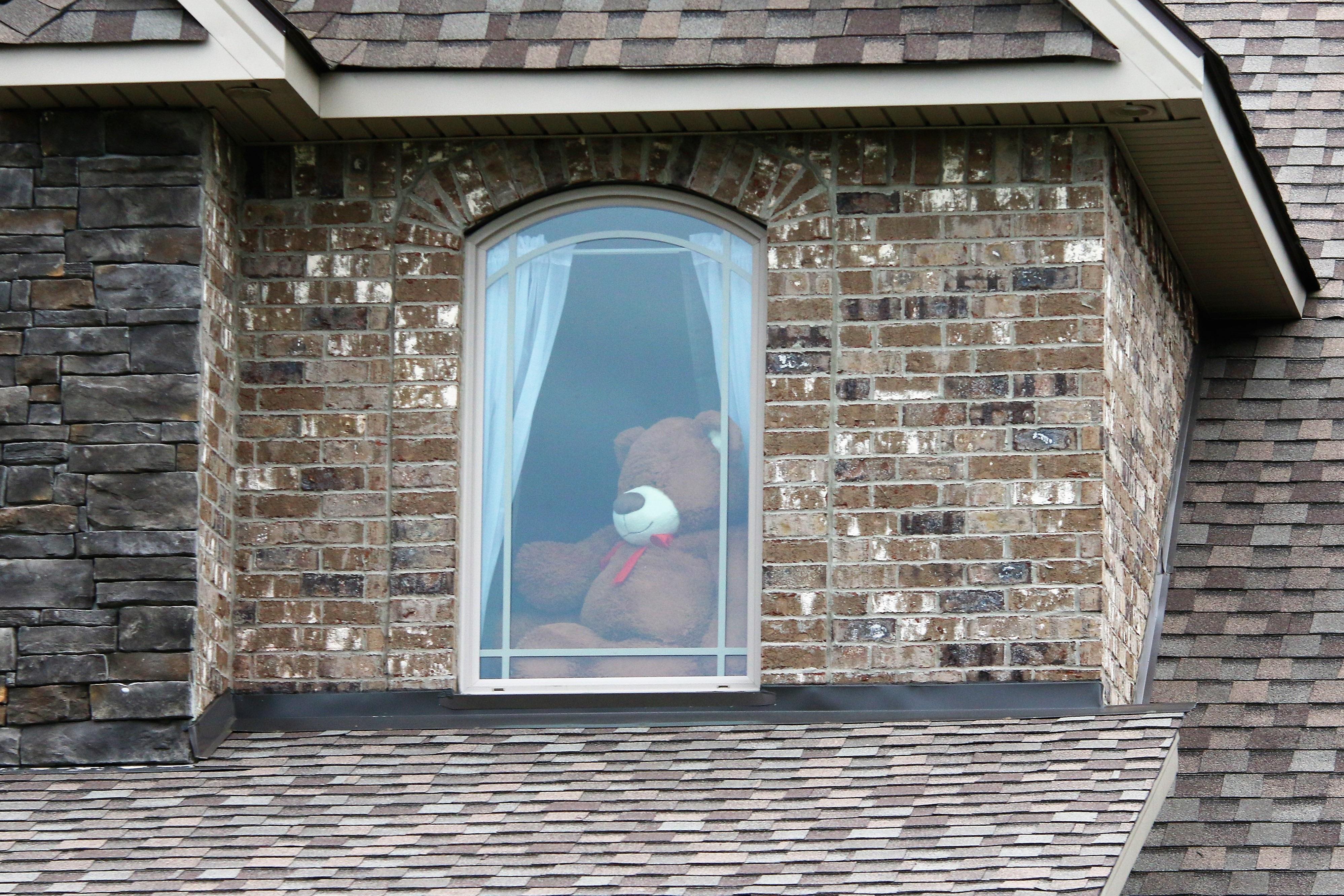 A teddy bear in the window of a home in Murfreesboro, Tenn.