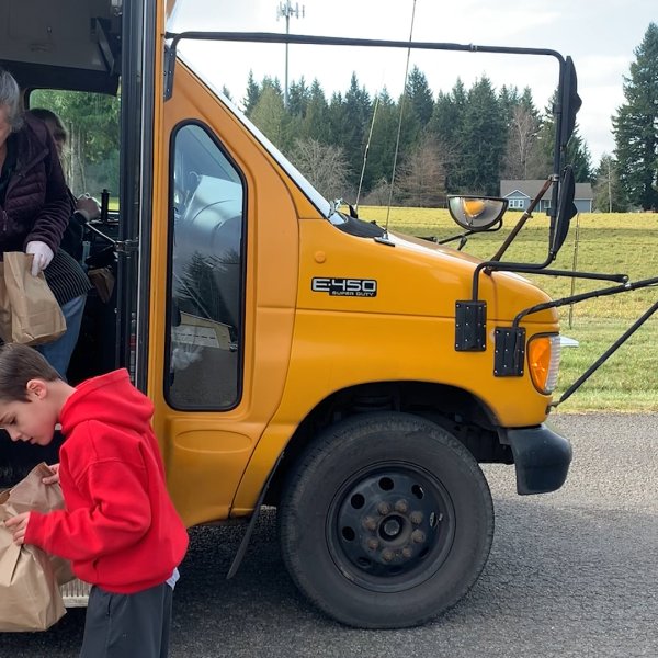Staff members of Oregon's Estacada School District drop off lunches to students on March 18, 2020