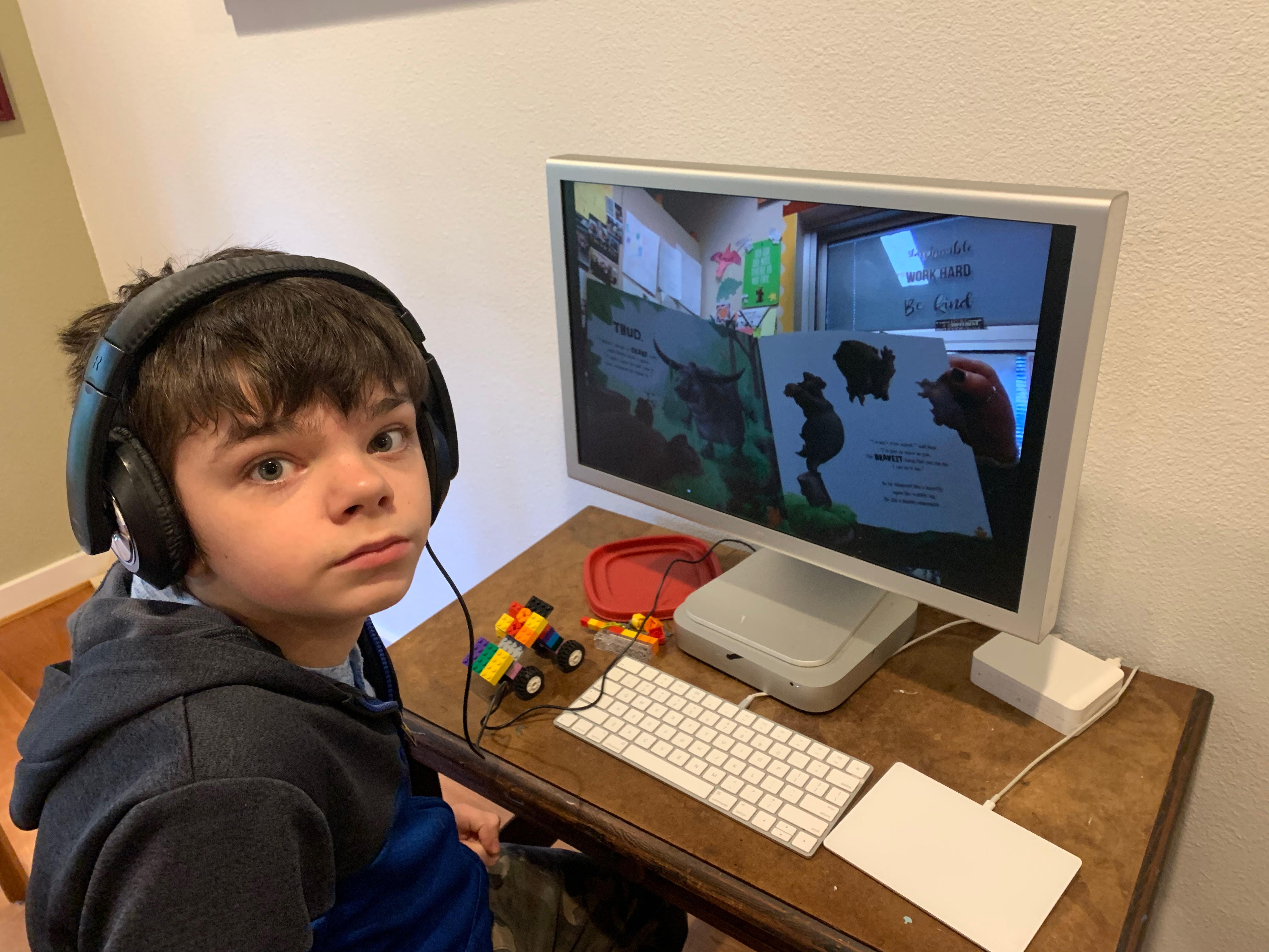 Daniel Sabol, an 8th grader in the Northshore School District in Bothell, Washington, watches his teacher read a book on YouTube after the school district closed classes on March 9, 2020 and transitioned temporarily to online learning. (Courtesy Amy Amirault)