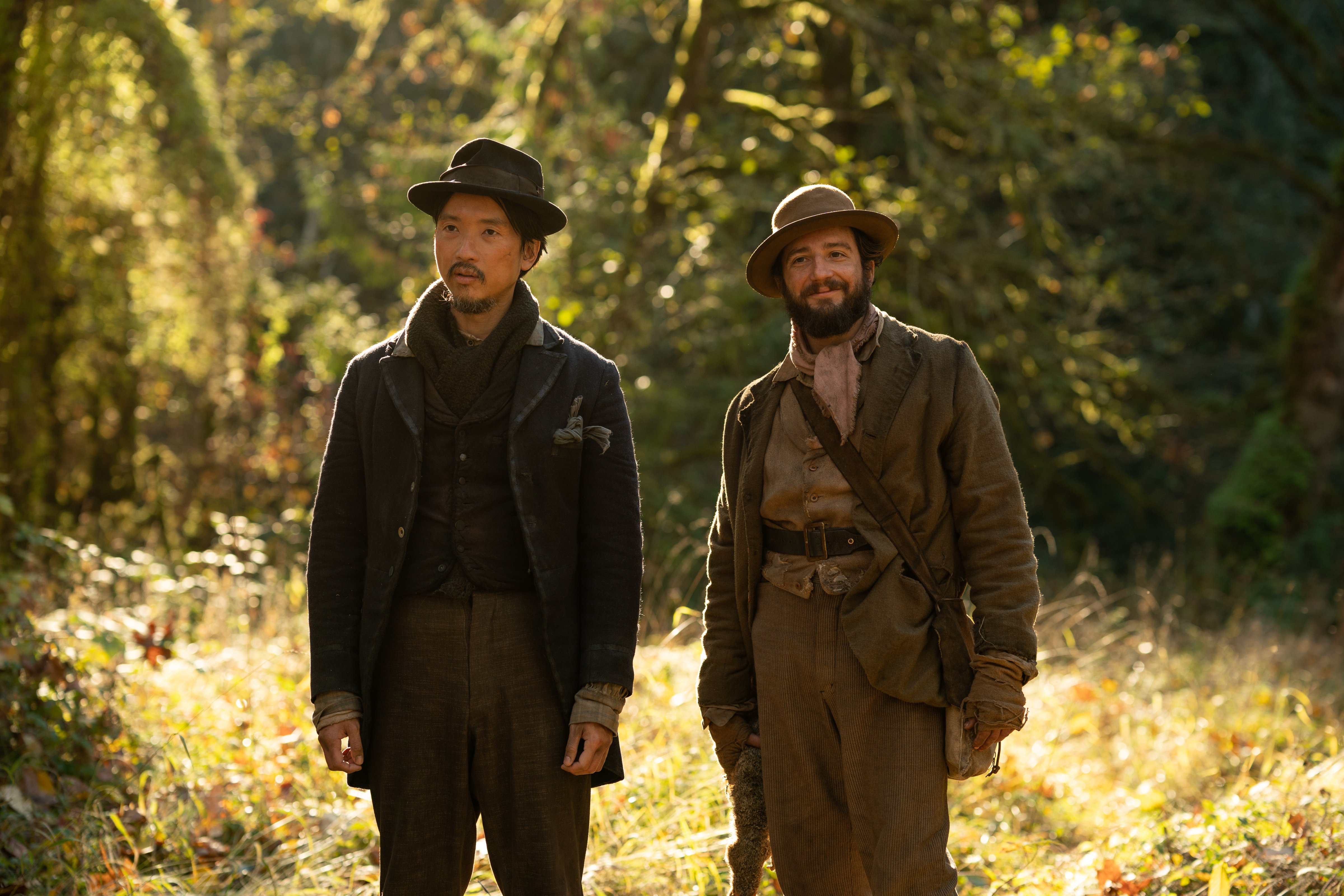 Orion Lee as King-Lu and John Magaro as Cookie in 'First Cow.' (Allyson Riggs / A24 Films)
