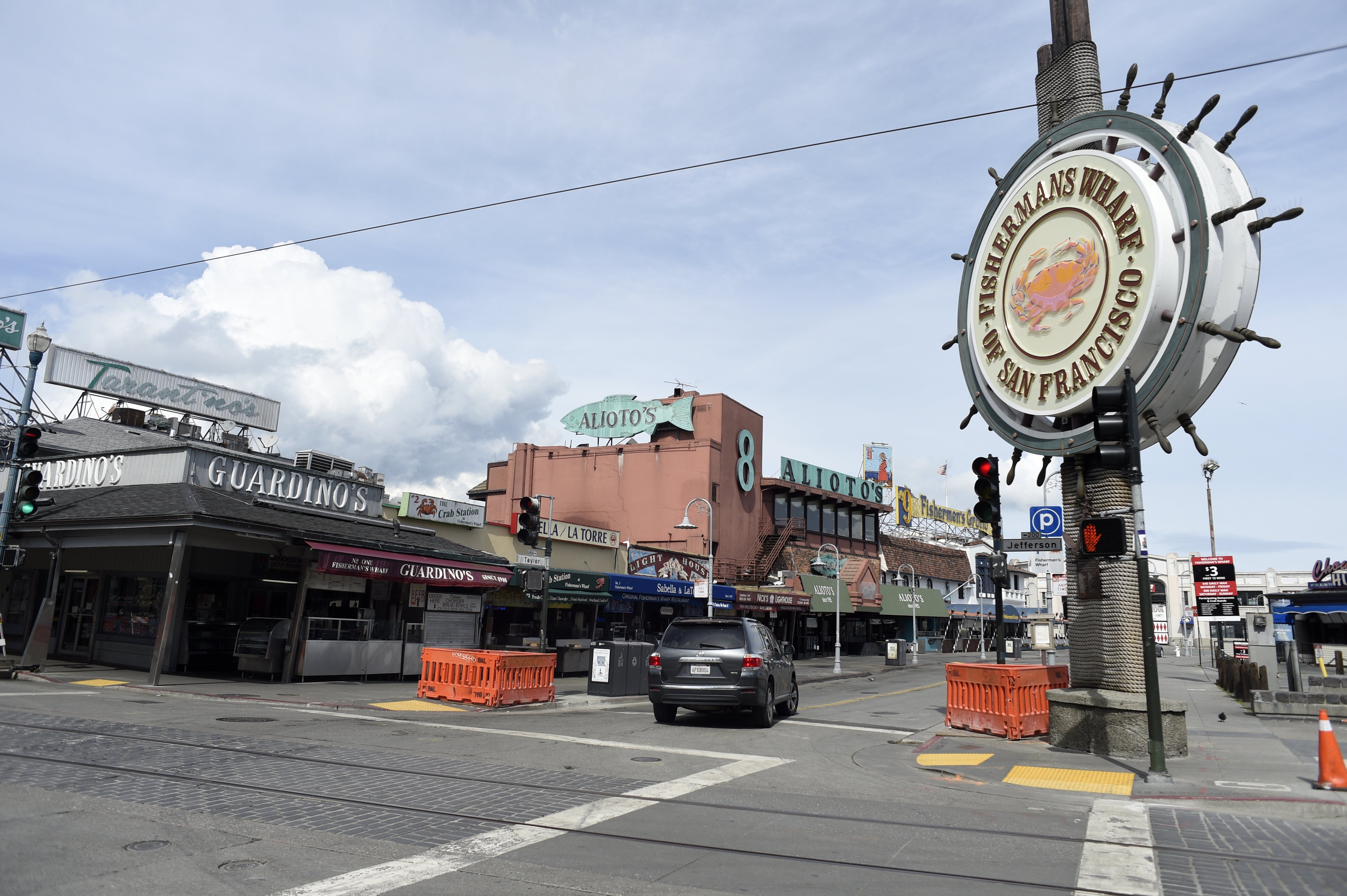 Fisherman's Wharf in San Francisco, normally crowded with tourists and locals, was virtually deserted on as millions of people in several Bay Area counties were under orders to stay in their homes starting March 17, 2020, to combat spread of the coronavirus. (Neal Waters—Anadolu Agency/Getty Images)