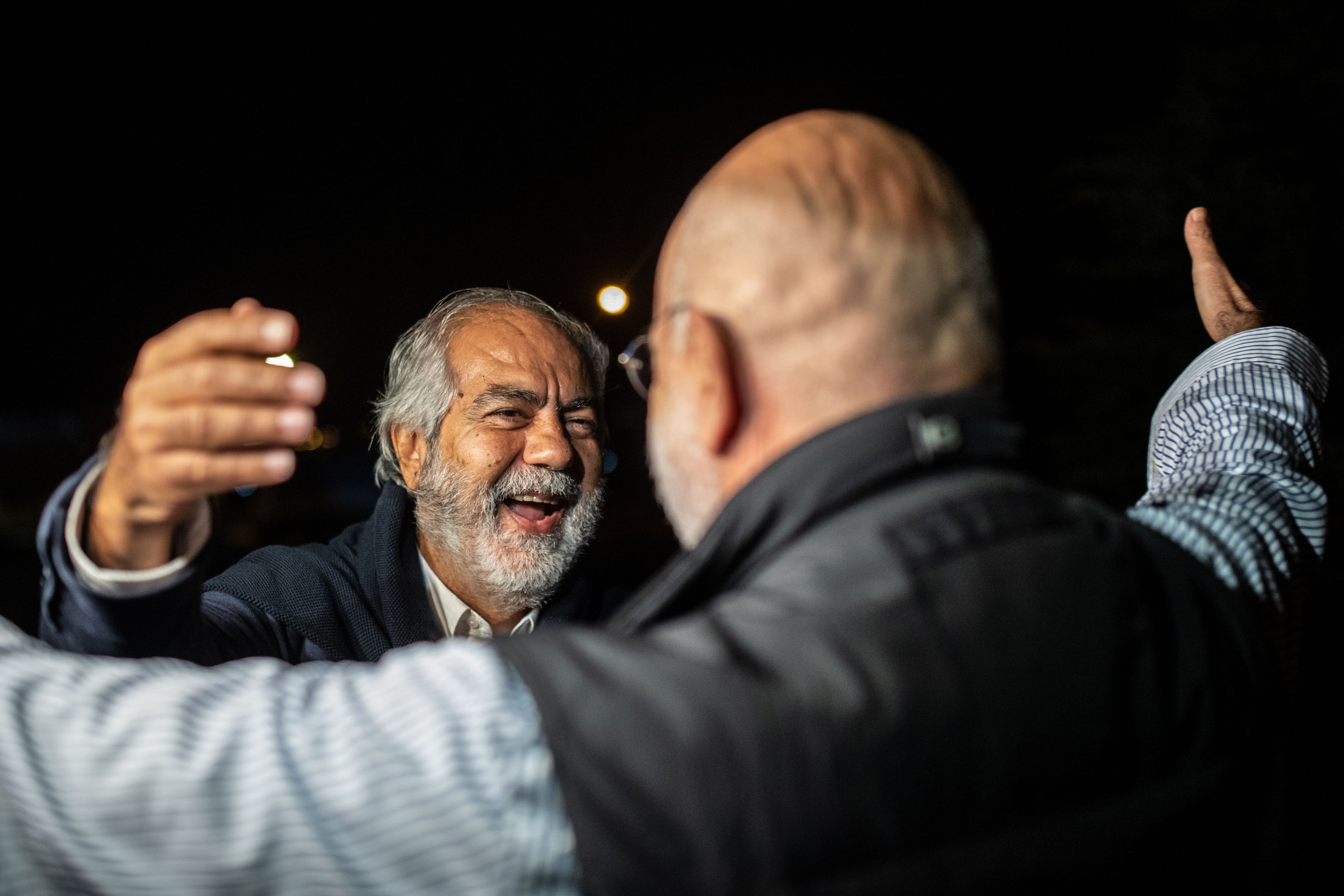 Turkish journalist and writer Ahmet Altan embraces his brother Mehmet (L) after being released on Nov. 4, 2019. Ahmet Altan was re-arrested a week later. (Bulent Kilic—AFP/Getty Images)