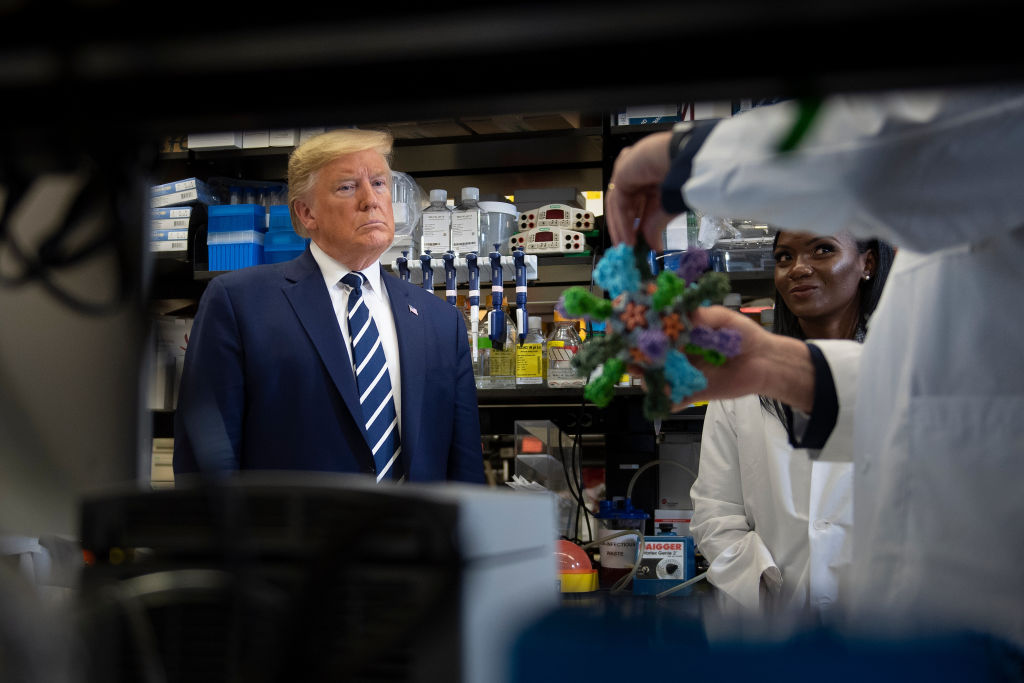 President Trump looks at models during a tour of the National Institutes of Health's Vaccine Research Center in Bethesda, Maryland on March 3, 2020. (Brendan Smialowski— AFP/Getty Images)
