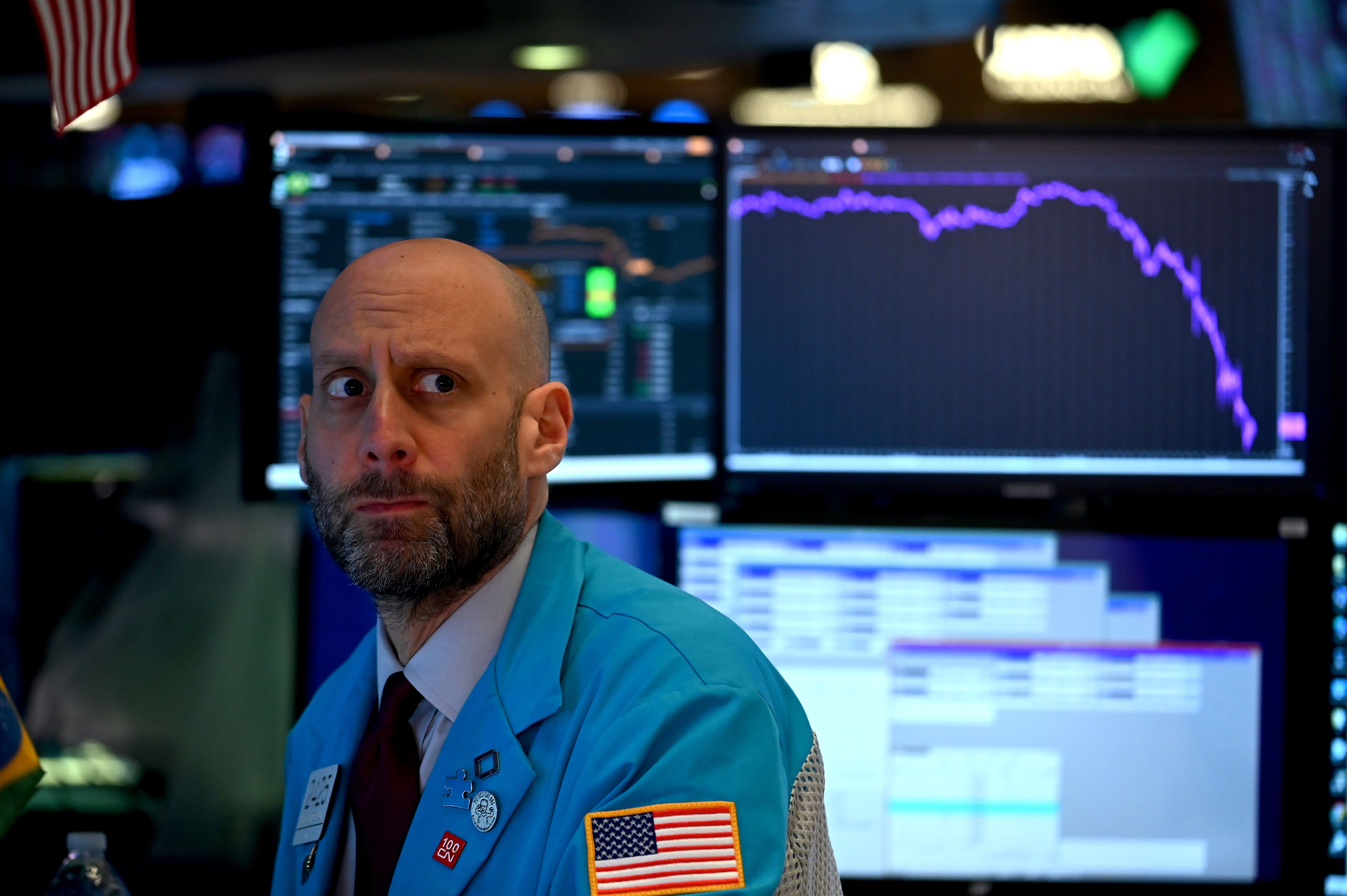 Traders work during the closing bell at the New York Stock Exchange on March 17, 2020 in New York City. The coronavirus has led to financial uncertainty, including job losses and business closures, across the globe. (Johannes Eisele—AFP/Getty Images)