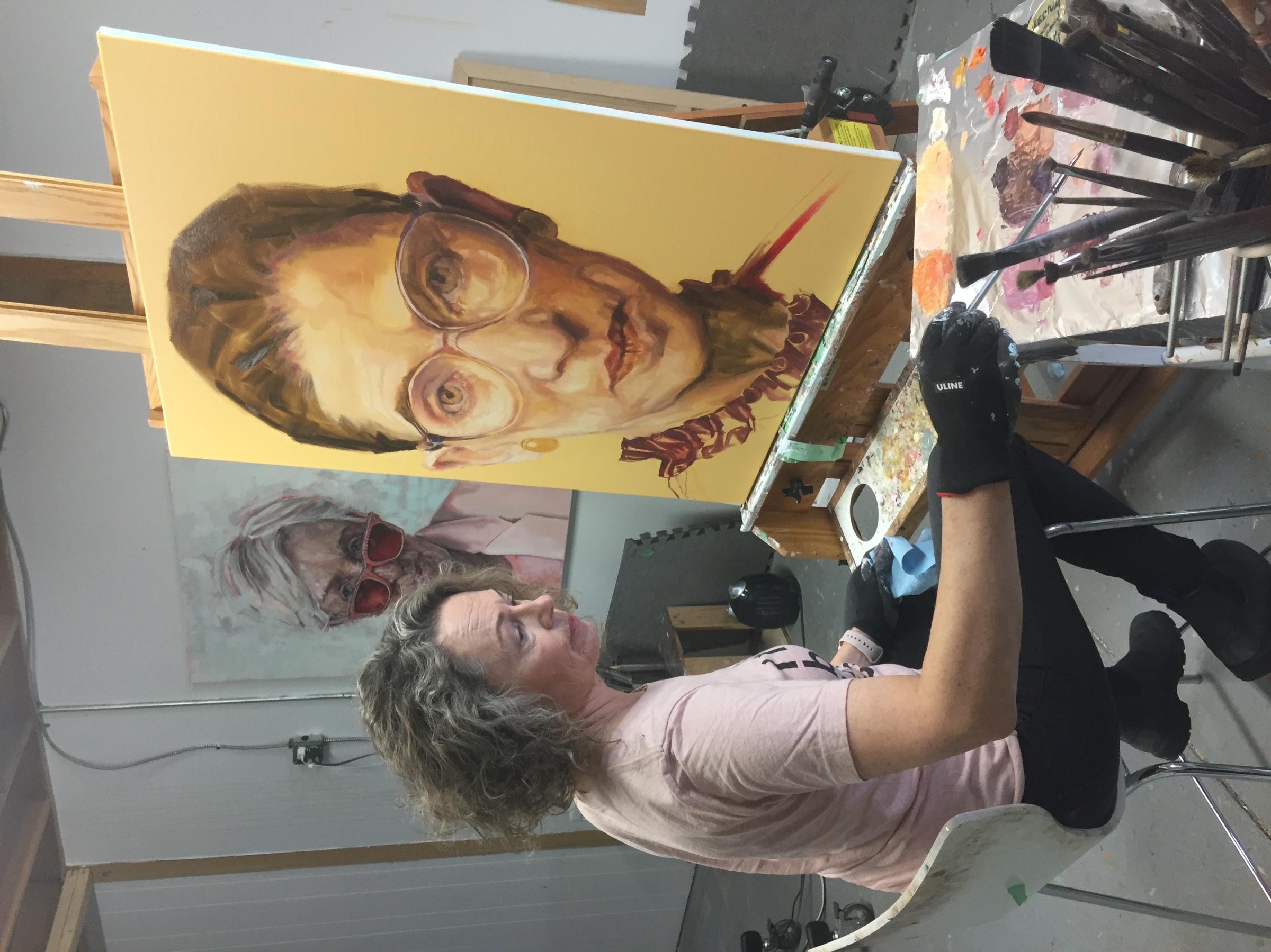 Shana Wilson painting RBG in her studio