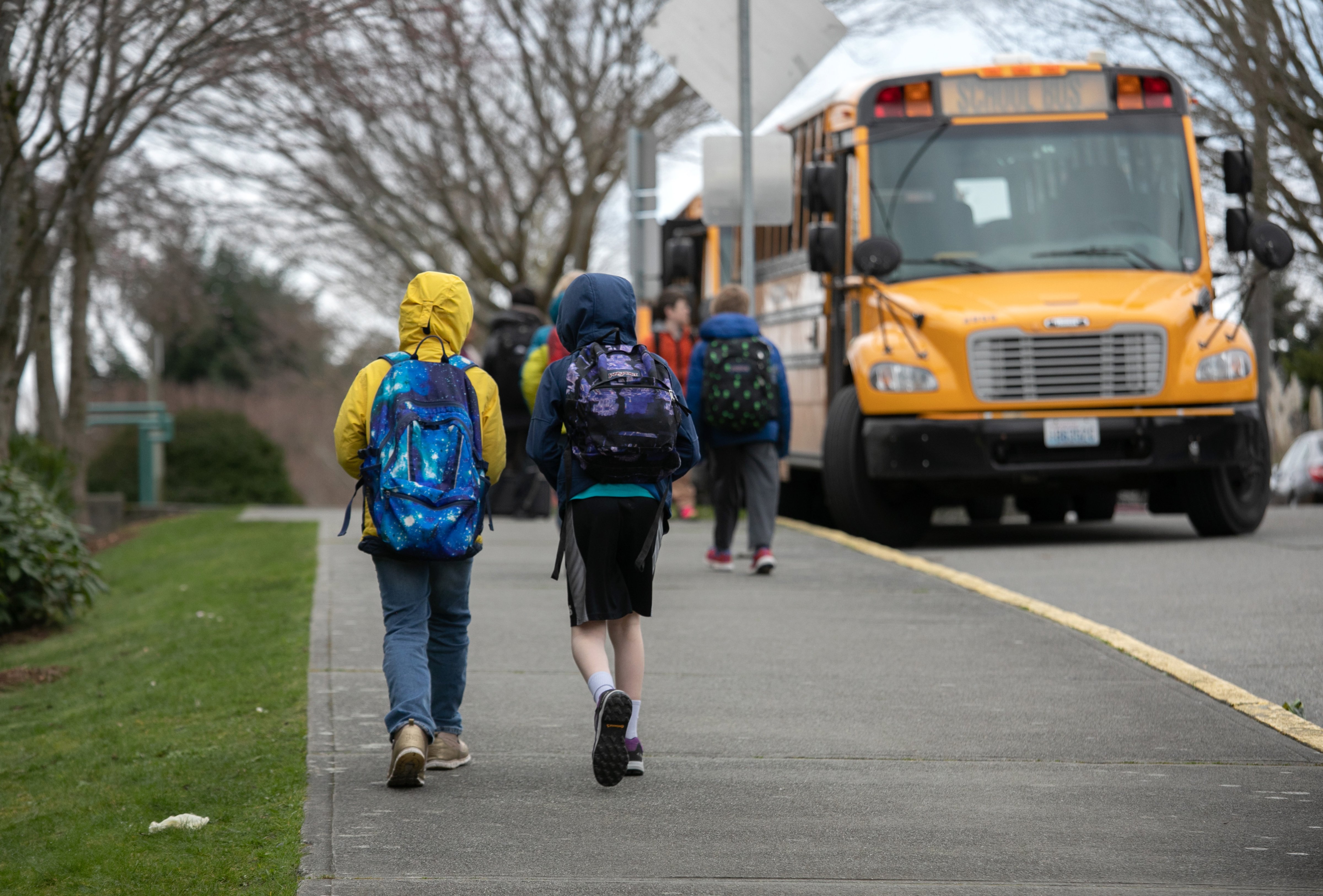Students leave an elementary school in Seattle, Washington, after the Seattle Public School system closed due to coronavirus concerns on March 11, 2020. (John Moore—Getty Images)