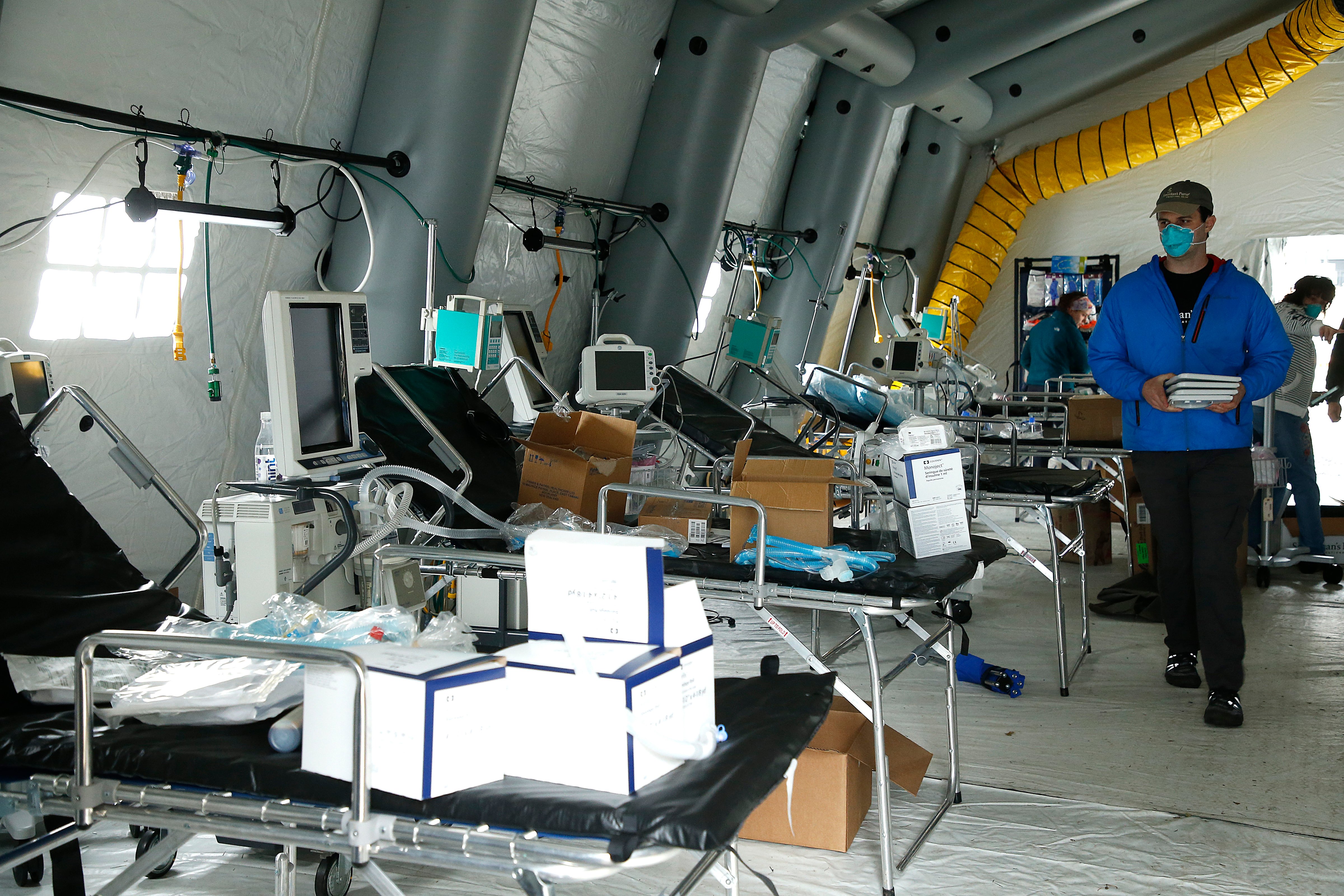 A hospital room is prepared at a temporary hospital in Central Park on March 30, 2020 in New York City. The facility is a partnership between Mt. Sinai Hospital and Christian humanitarian aid organization Samaritan's Purse, equipped with 68 beds to treat COVID-19 patients. (John Lamparski—Getty Images)