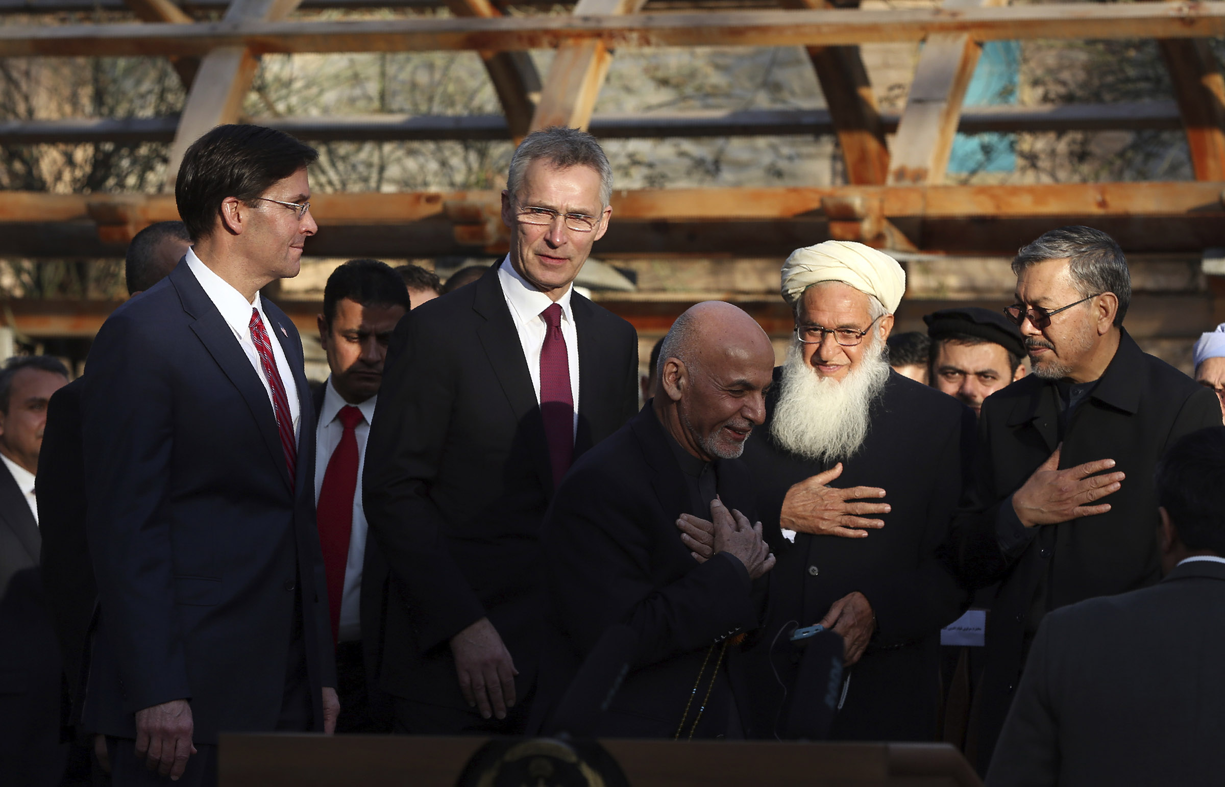 Afghan President Ashraf Ghani, center, arrives with NATO Secretary General Jens Stoltenberg, and U.S. Secretary of Defense Mark Esper for a joint news conference at the presidential palace in Kabul, Afghanistan on Feb. 29, 2020. (Rahmat Gul—AP)