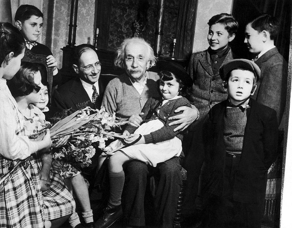 Albert Einstein celebrating his 70th birthday with children from a displaced persons camp on Mar. 13, 1949, at his home in Princeton, N.J. (Gamma-Keystone—Getty Images)