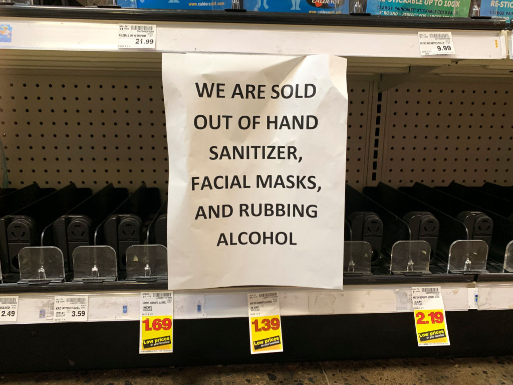A sign advising out-of-stock sanitizer, facial masks and rubbing alcohol is seen at a store following warnings about COVID-19 in Kirkland, Washington. (Jason Redmond—AFP/Getty Images)