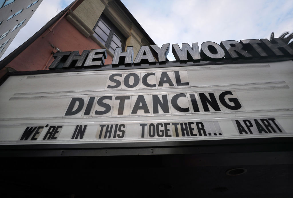 The shuttered Hayworth Theatre displays the message 'Social Distancing We're In This Together...Apart' on the marquee on March 23, 2020 in Los Angeles. (Mario Tama—Getty Images)