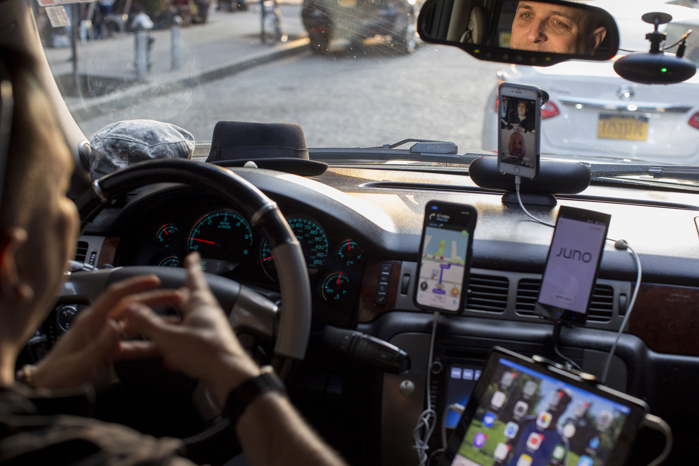 A driver for multiple ride-share companies with several devices on at once in New York, June 7, 2018. (Dave Sanders/The New York Times)