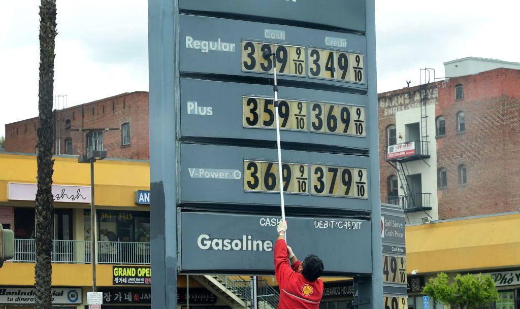 Gas station prices are adjusted as prices fall nationwide due to the coronavirus pandemic in Los Angeles on March 20, 2020. Low fossil fuel prices offer a great opportunity to eliminate the billions of dollars in government subsidies that support oil and gas, analysts say. (Frederic J. Brown/AFP—Getty Images)