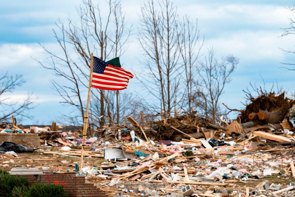 A flag flaps in the wind as President Donald Trump tours tornado damage in Cookeville, Tennessee on March 6, 2020. (JIM WATSON/—Getty Images)