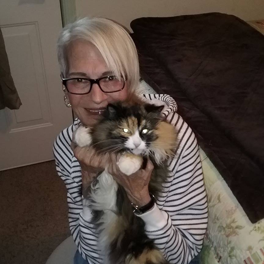 A grandma with a popular TikTok presence, Linda Roper, snuggles with her cat, Sadie. (Courtesy of Crystal Dvorak)