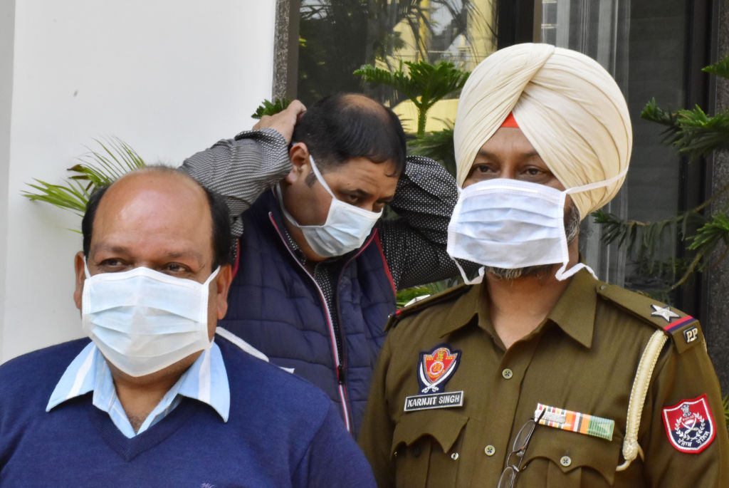 Health department officials and police personnel seen wearing masks while conducting a mock drill in which doctors educated people about COVID-19 on March 12, 2020 in Amritsar, India. (Sameer Sehgal/Hindustan Times—Getty Images)
