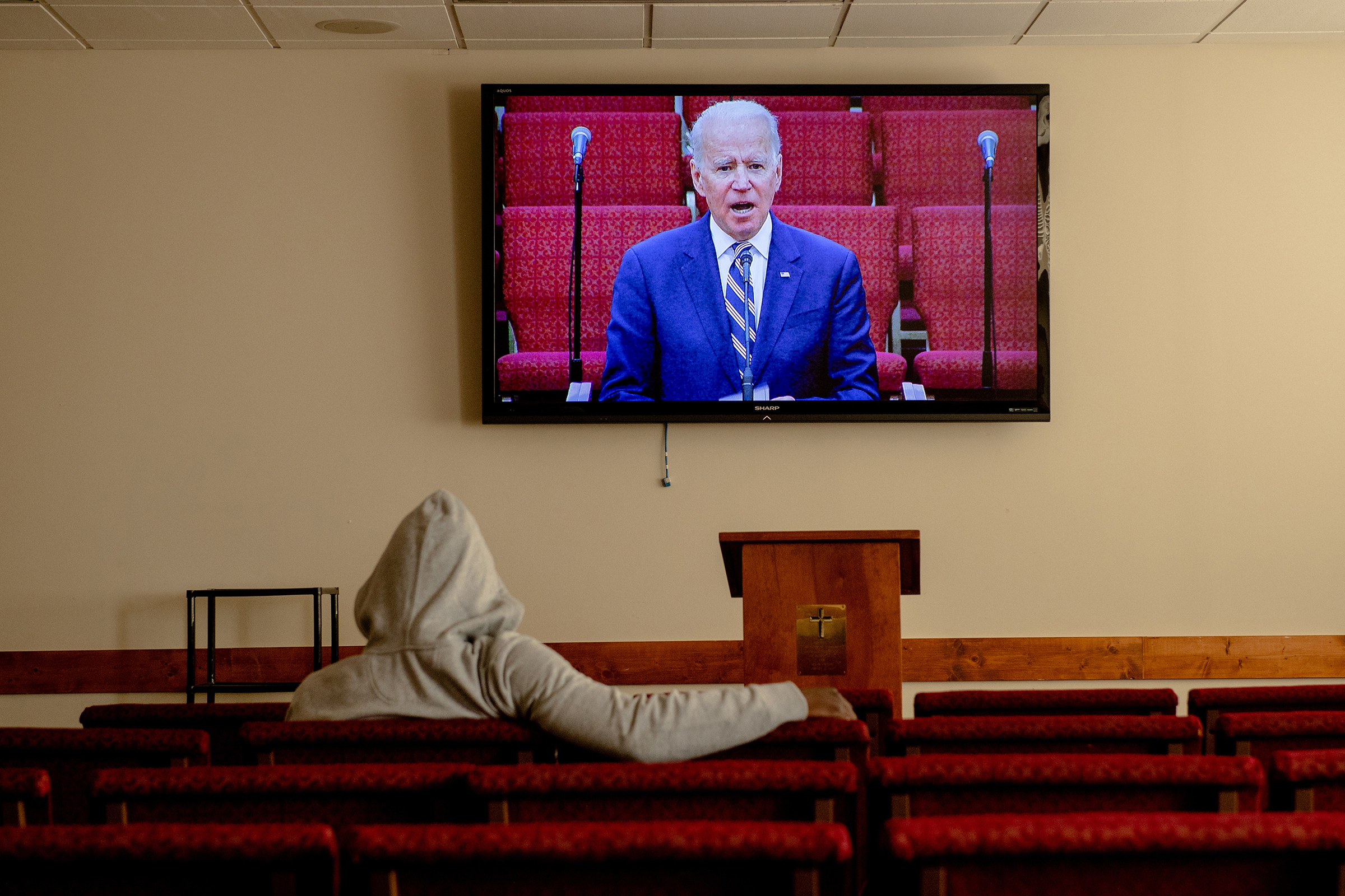 A screen shows Democratic presidential candidate Joe Biden during a service at Royal Missionary Baptist Church in North Charleston, S.C., on Feb. 23, 2020.