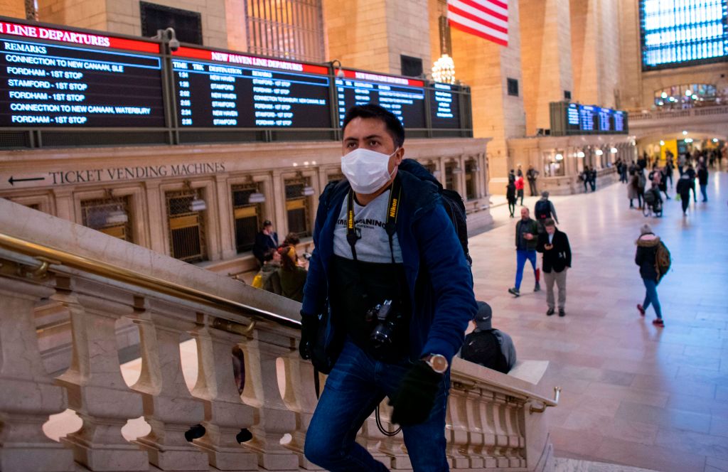 A man wears a face mask as he walks inside Grand Central Station in New York City on Mar. 8, 2020. (Kena Betancur—AFP/Getty Images)
