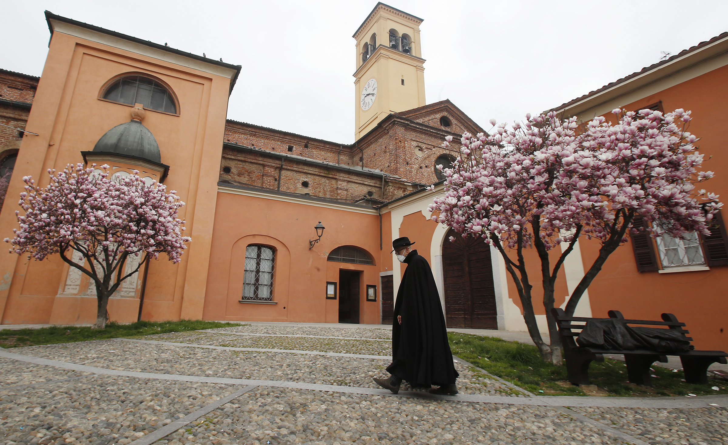 A priest walks in Codogno, Italy, on March 12, 2020. (Antonio Calanni—AP)