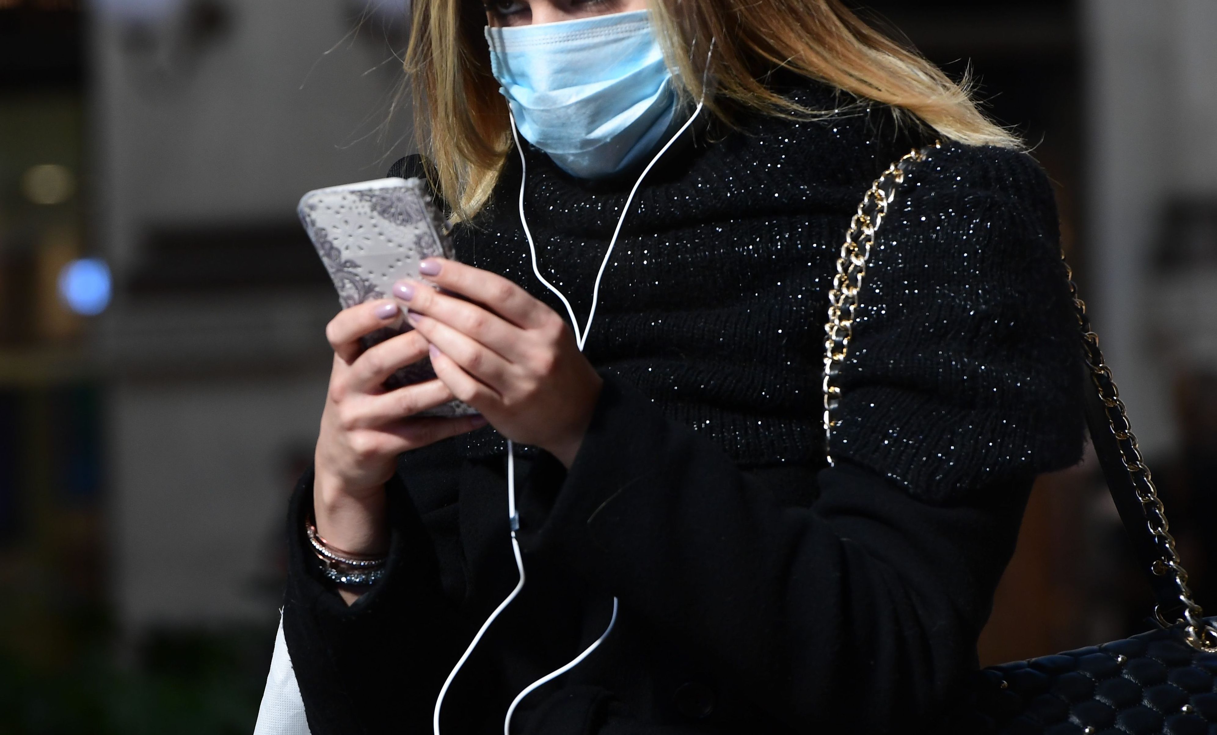 A woman wearing a protective mask on Feb. 28, 2020. (Miguel Medina—AFP/Getty Images)