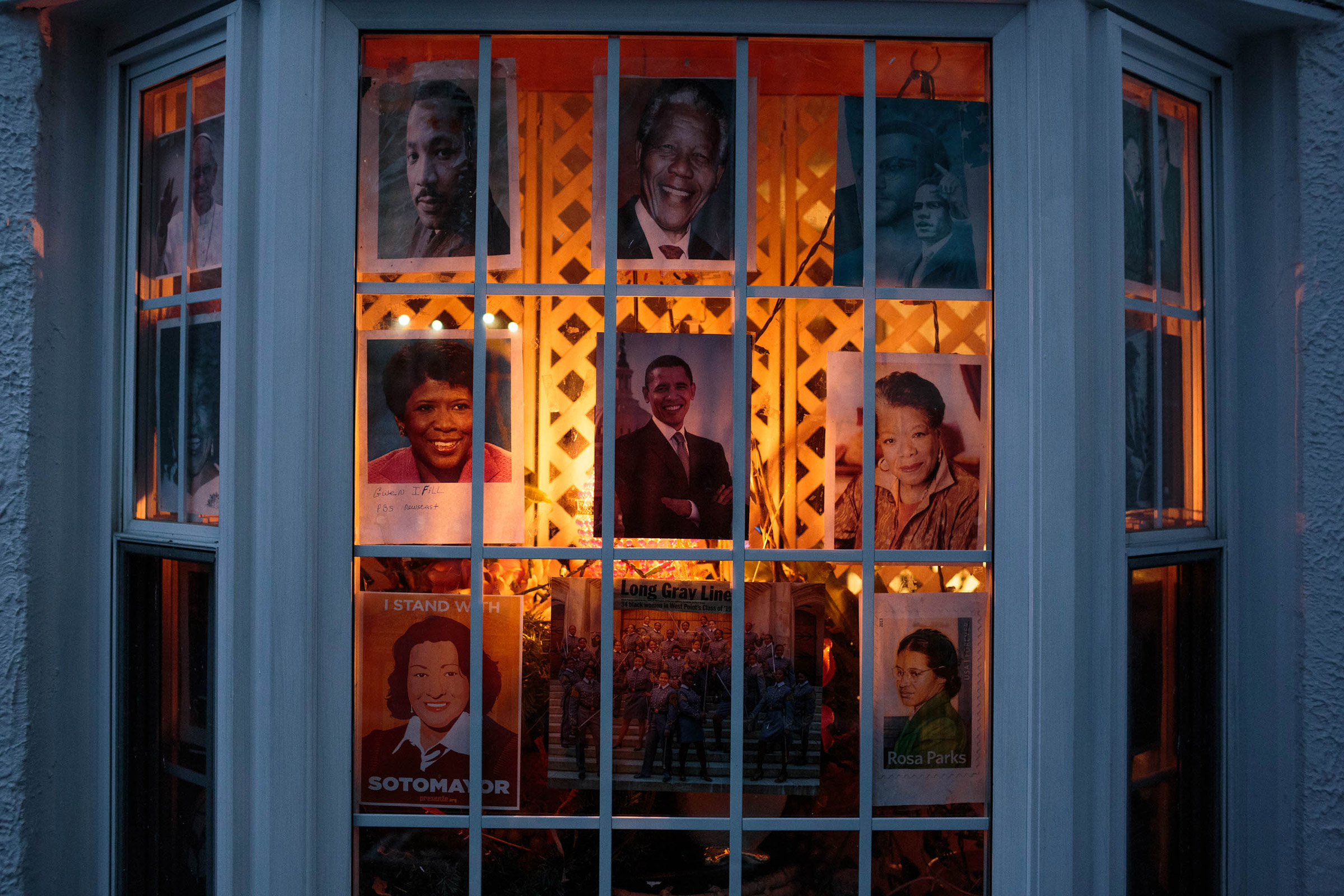 The front window of the Romey home in Bushwick is decorated with pictures of Blanche's idols