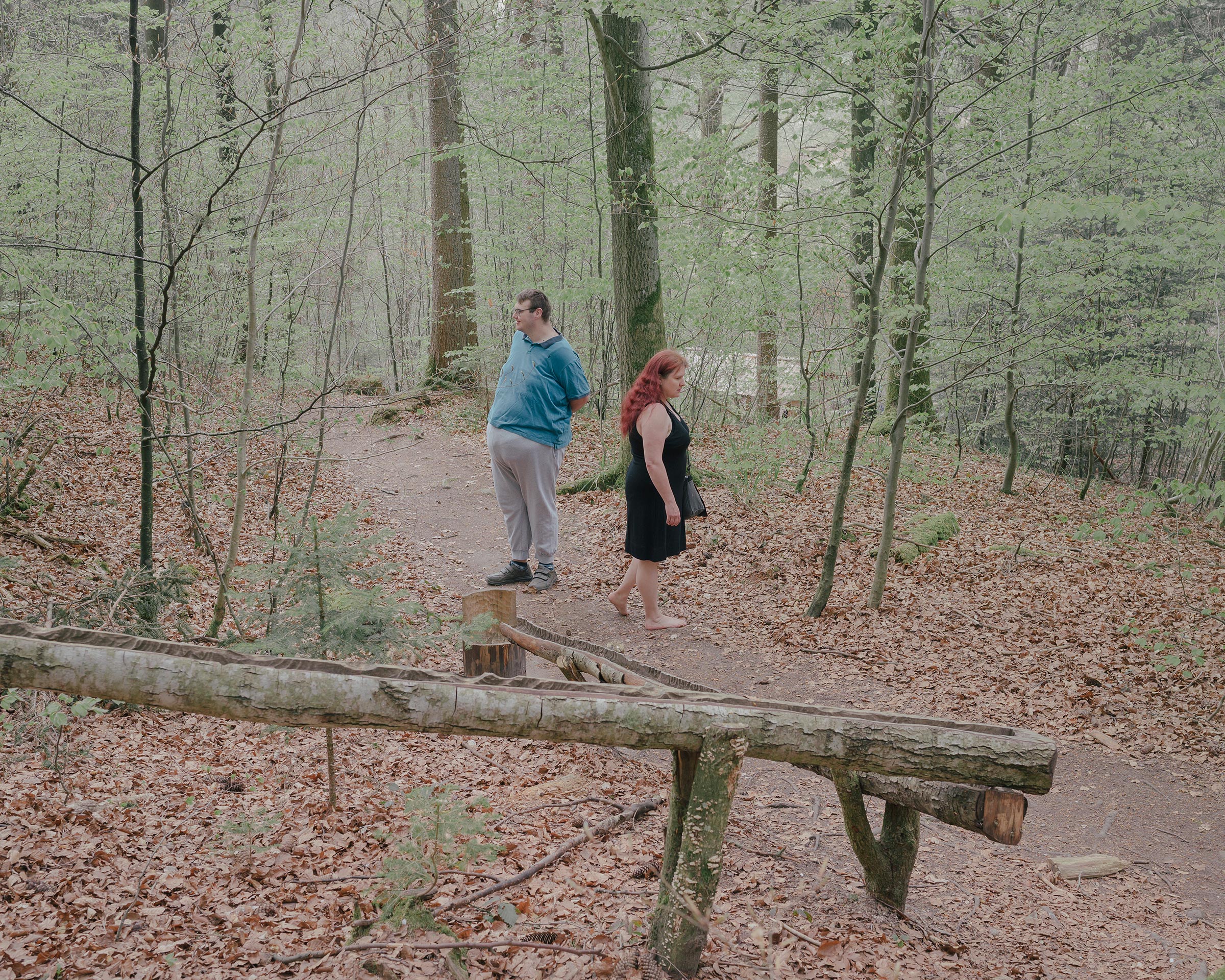 Michaela Schenker and her son Lukas take a walk through a forest near the village Ellenberg on April 19.