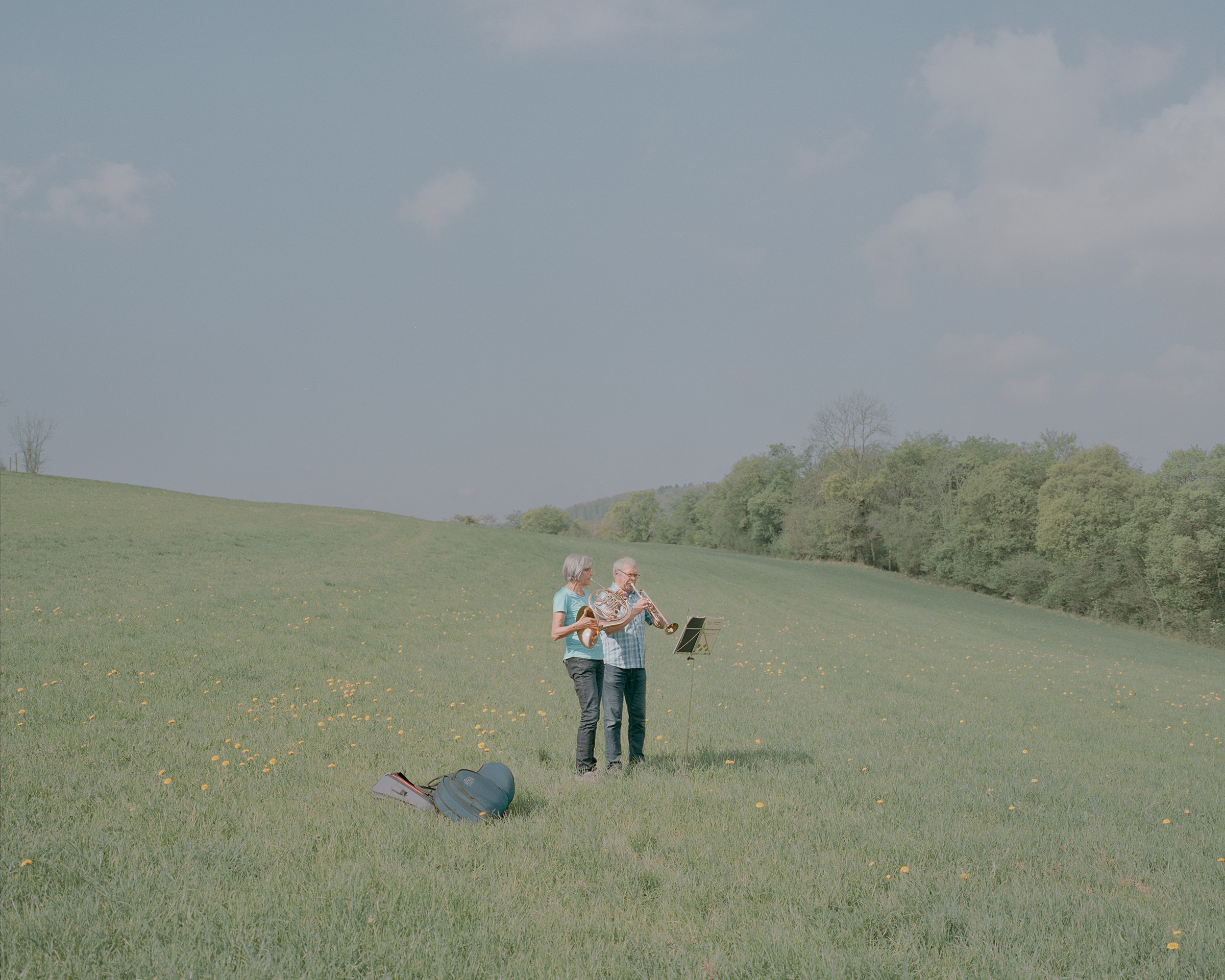 Andrea and Rainer Zube, pictured here on April 19, play in a meadow.