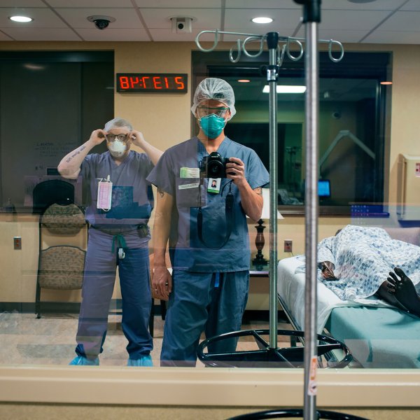 Paramedic Danny Kim photographs himself and his partner for the night shift, Brian Moriarty, beside a manikin patient at Holy Name Medical Center in Teaneck, N.J., on March 30. Kim made a visual diary of work being done in one community reeling from the COVID-19 pandemic