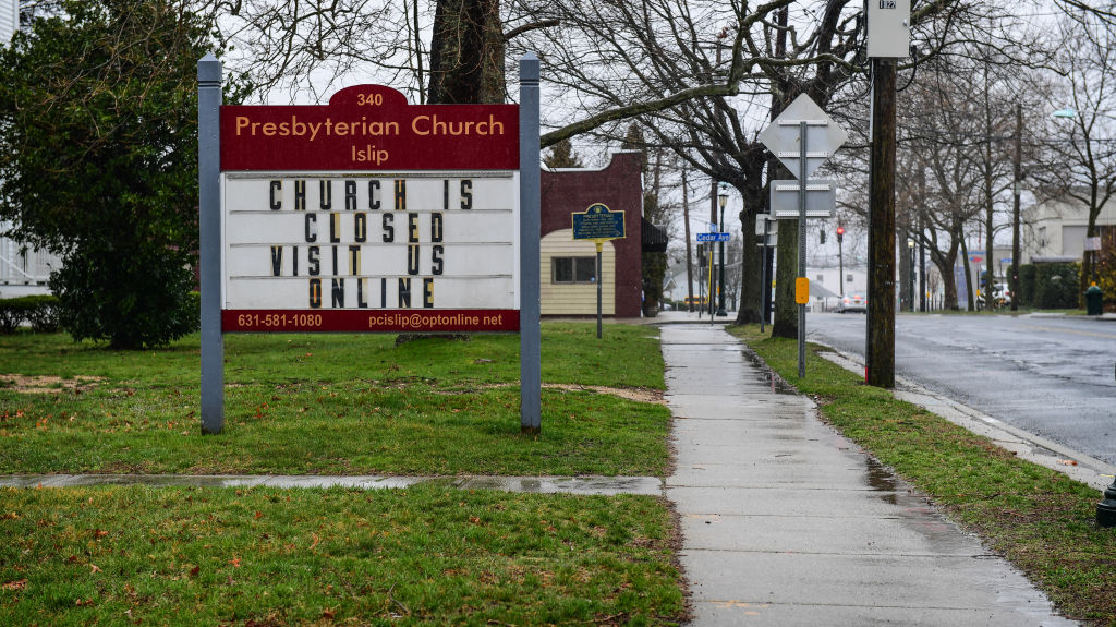 A sign at a Presbyterian church reads, "Church is closed, visit us online," as Long Islanders shelter in place for during the coronavirus crisis in Islip, New York, on March 23, 2020. (Thomas A. Ferrara—Newsday RM/Getty Images)