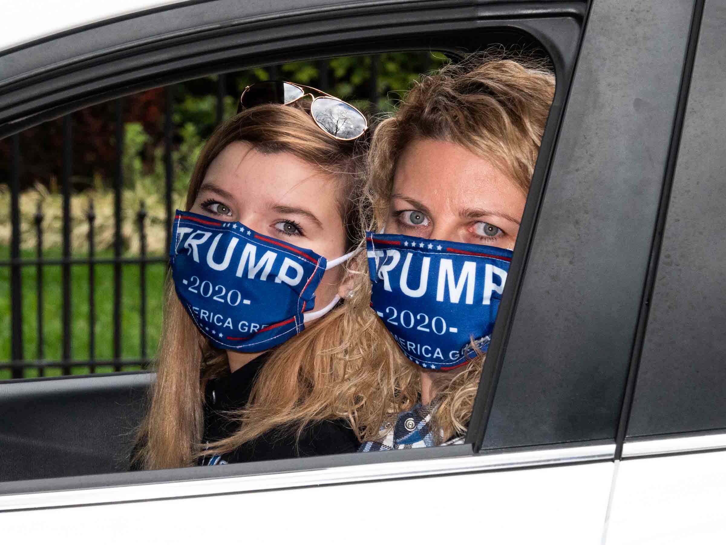 2020. USA. Annapolis, Maryland.  Two protestors, part of a caravan of cars that descended on the Maryland State House in Annapolis on 4/18 to protest the Coronavirus related restrictions